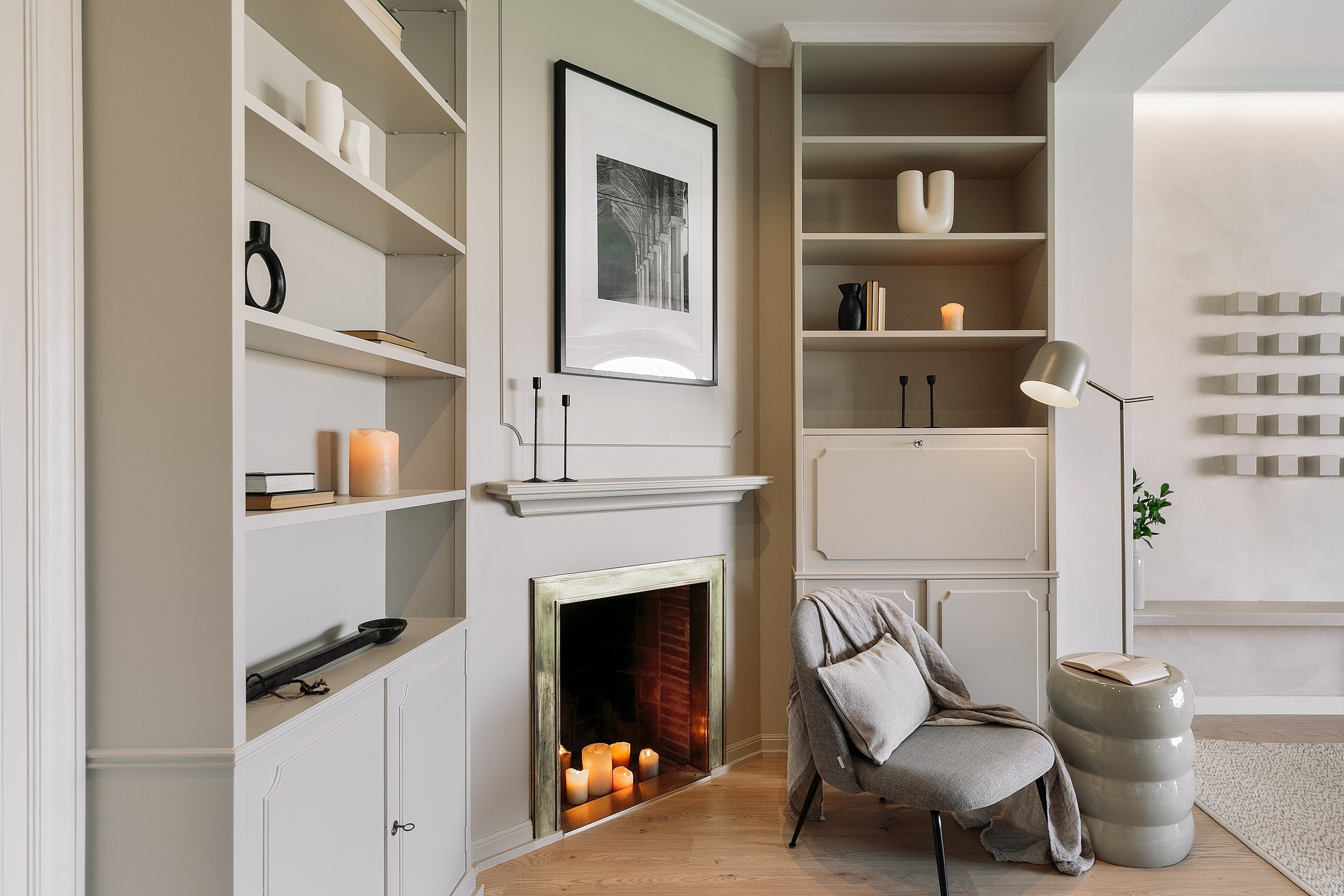 Living area with elegant decor, custom art, and calm beige tones, designed by SAVIA in Barcelona