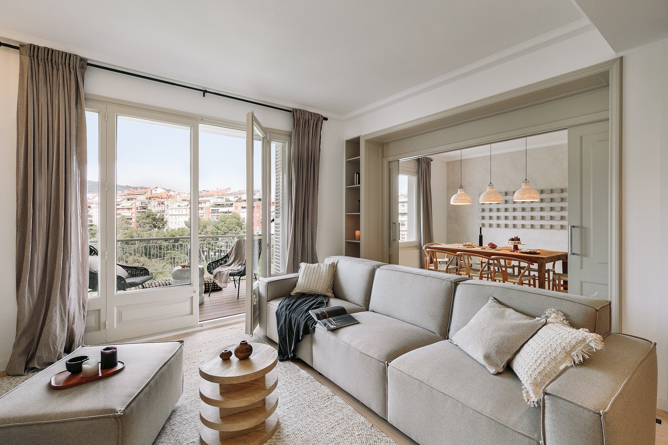 Elegant living room with bespoke wall installation, neutral tones, and subtle textures by SAVIA 