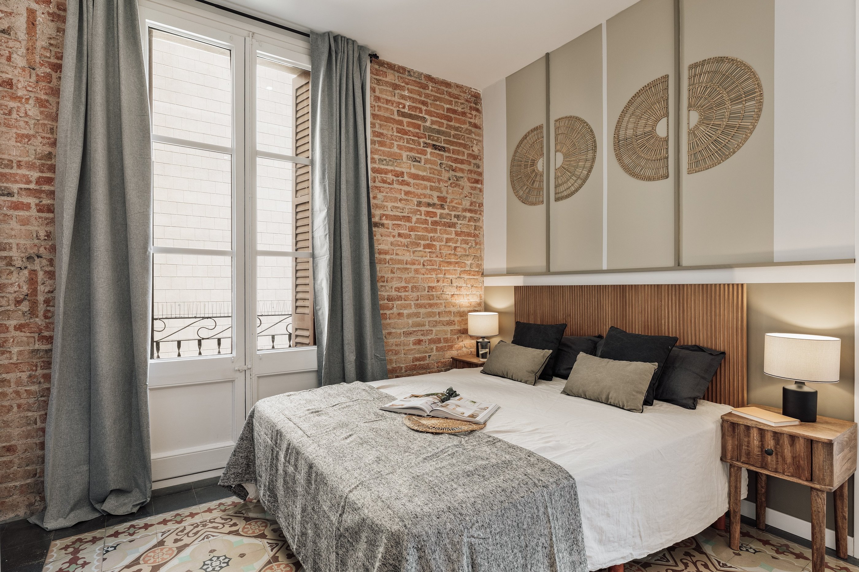 Relaxing bedroom with natural wood finishes, neutral tones, and minimalist design in Barcelona