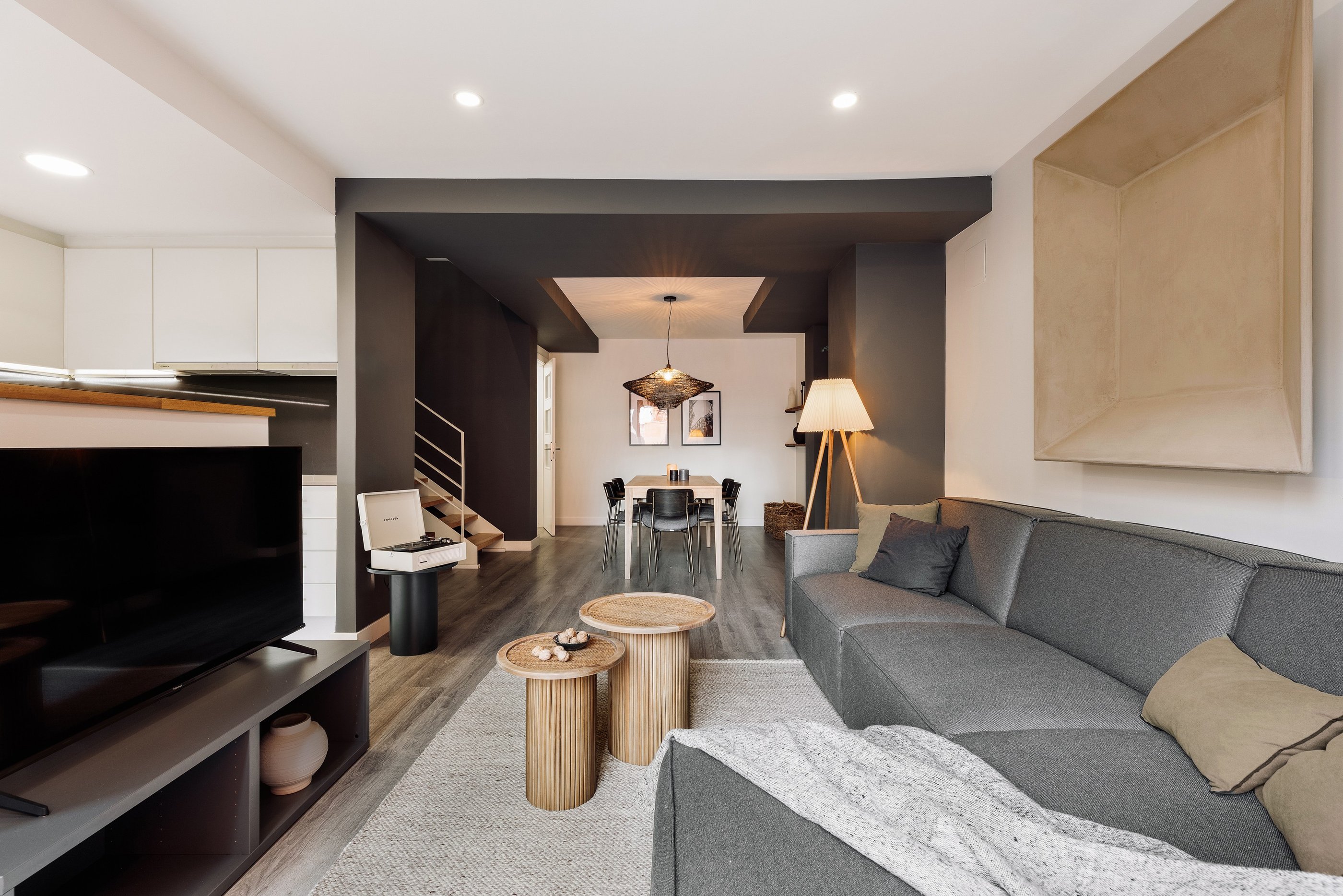 Vibrant living room with natural materials, bold colors, and modern design elements