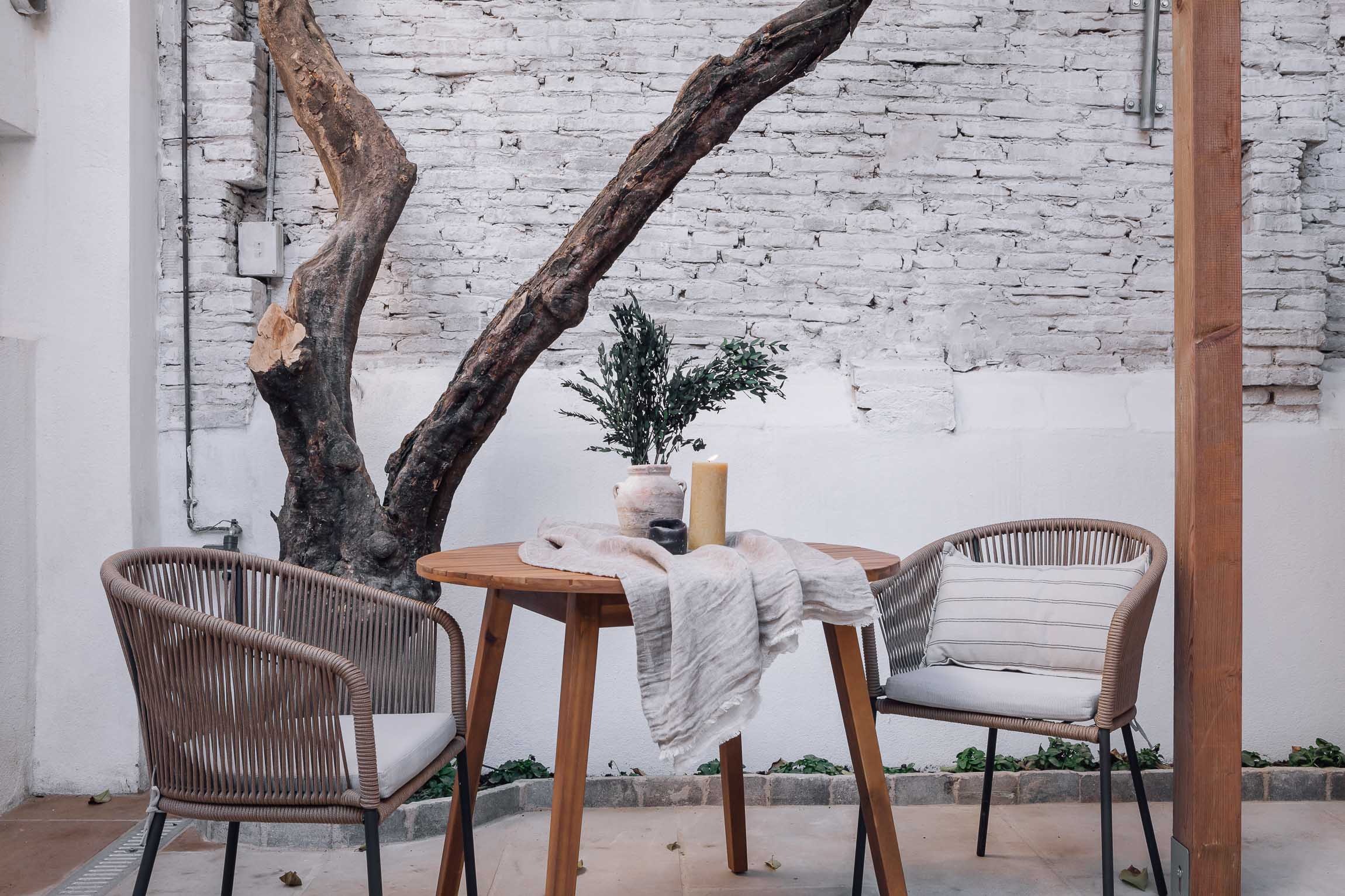 Outdoor terrace with seating, offering a serene atmosphere in Barcelona apartment
