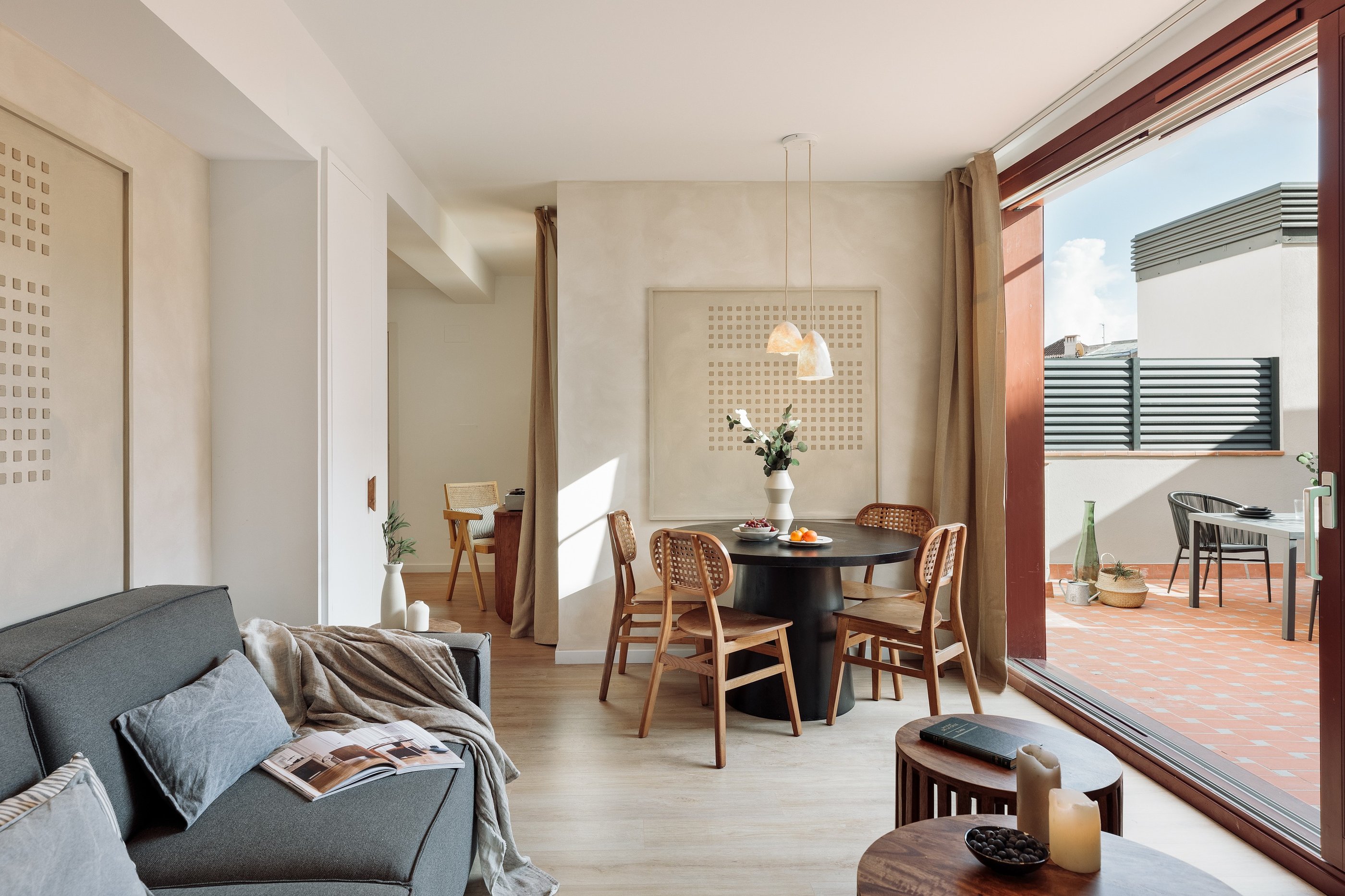 Elegant living room with contemporary design, large windows, wood elements in Barcelona