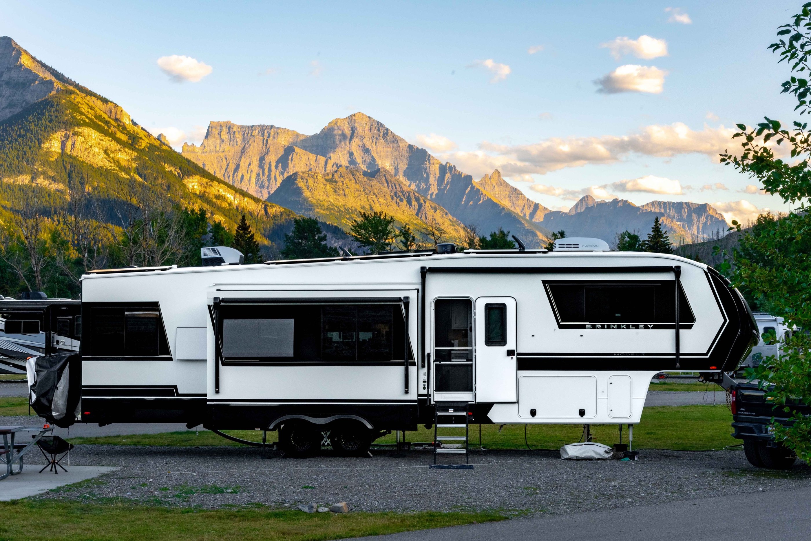 Brinkley RV at Waterton Lakes Campground with mountains in the background.