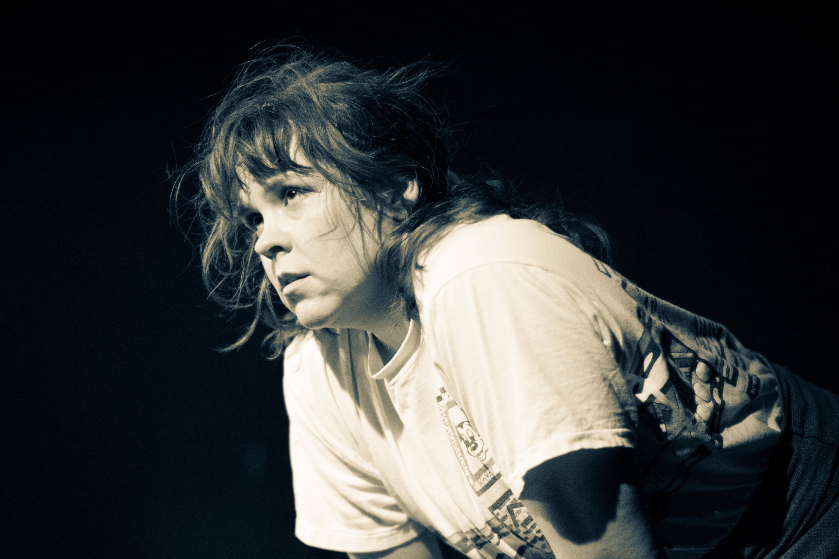 Woman leaning over and looking outward