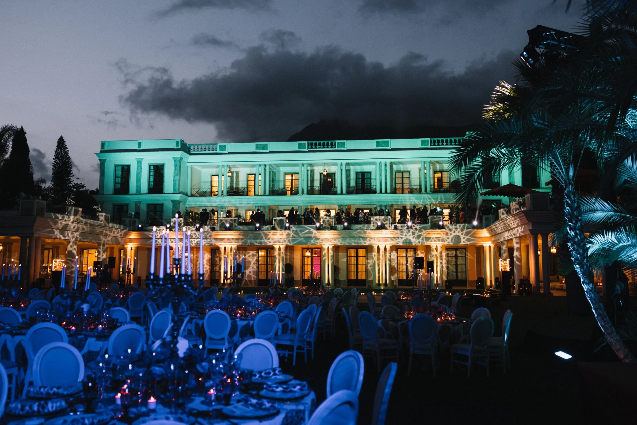 Evening gala event in illuminated villa gardens