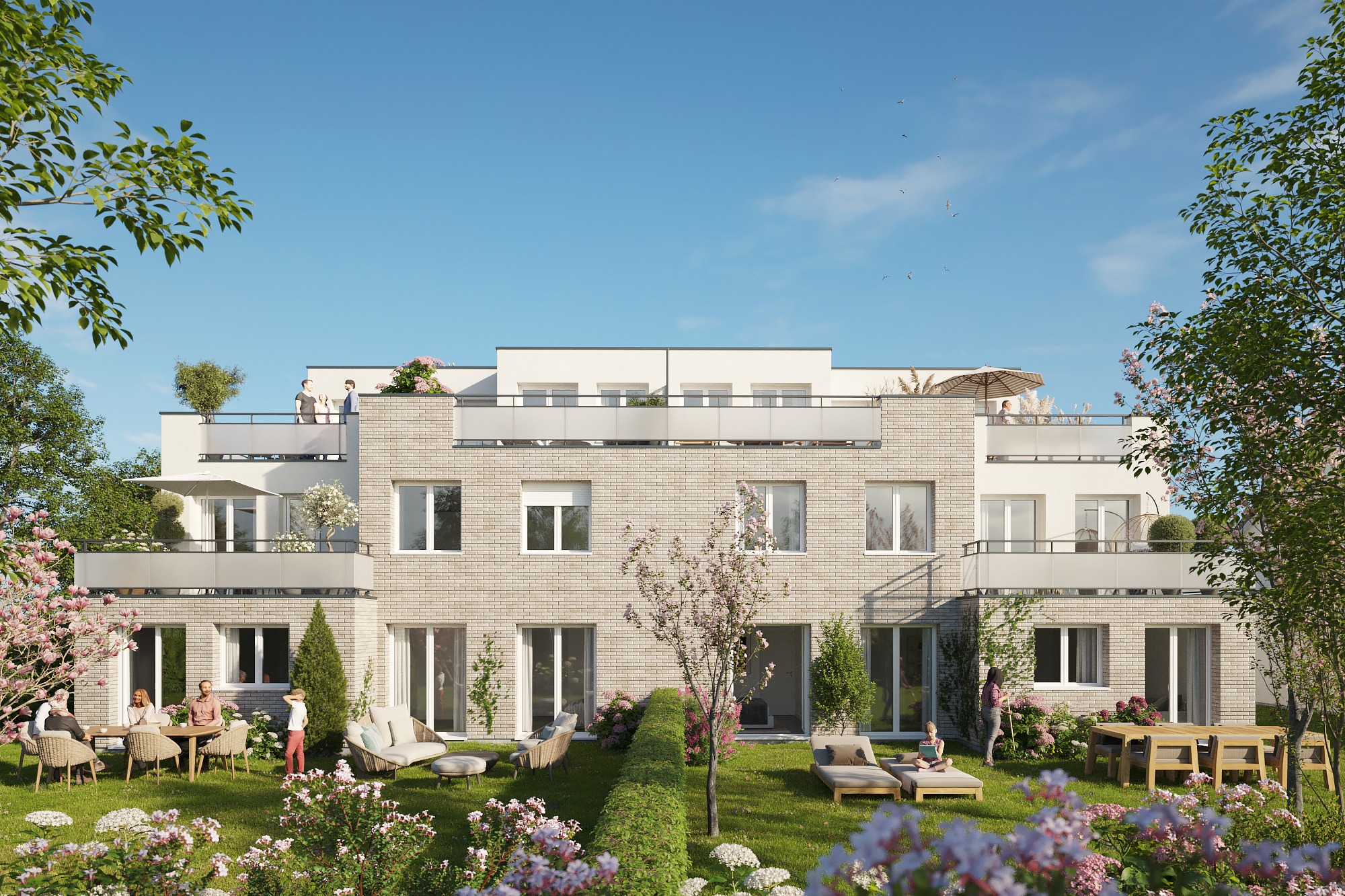 **Vue arrière de la Résidence Les Ricochets II avec jardins privatifs, terrasses spacieuses et espac