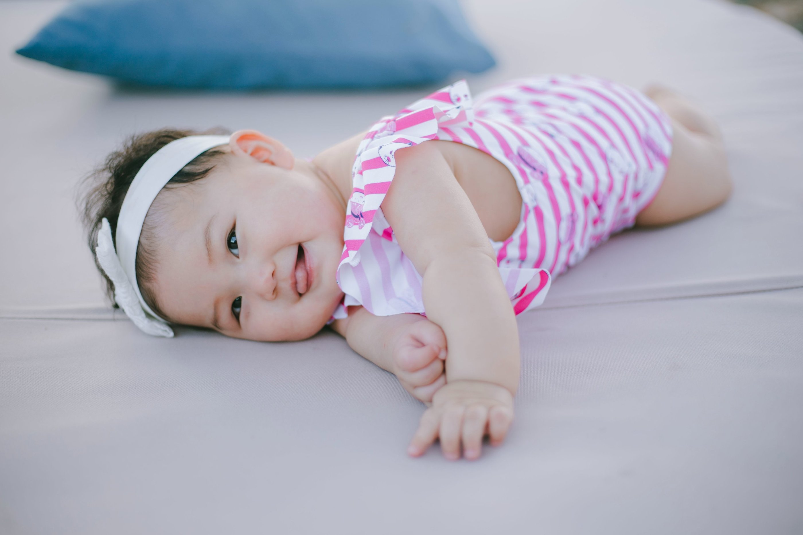 Baby lying on daybed during family photography session at Sofitel Nusa Dua Bali