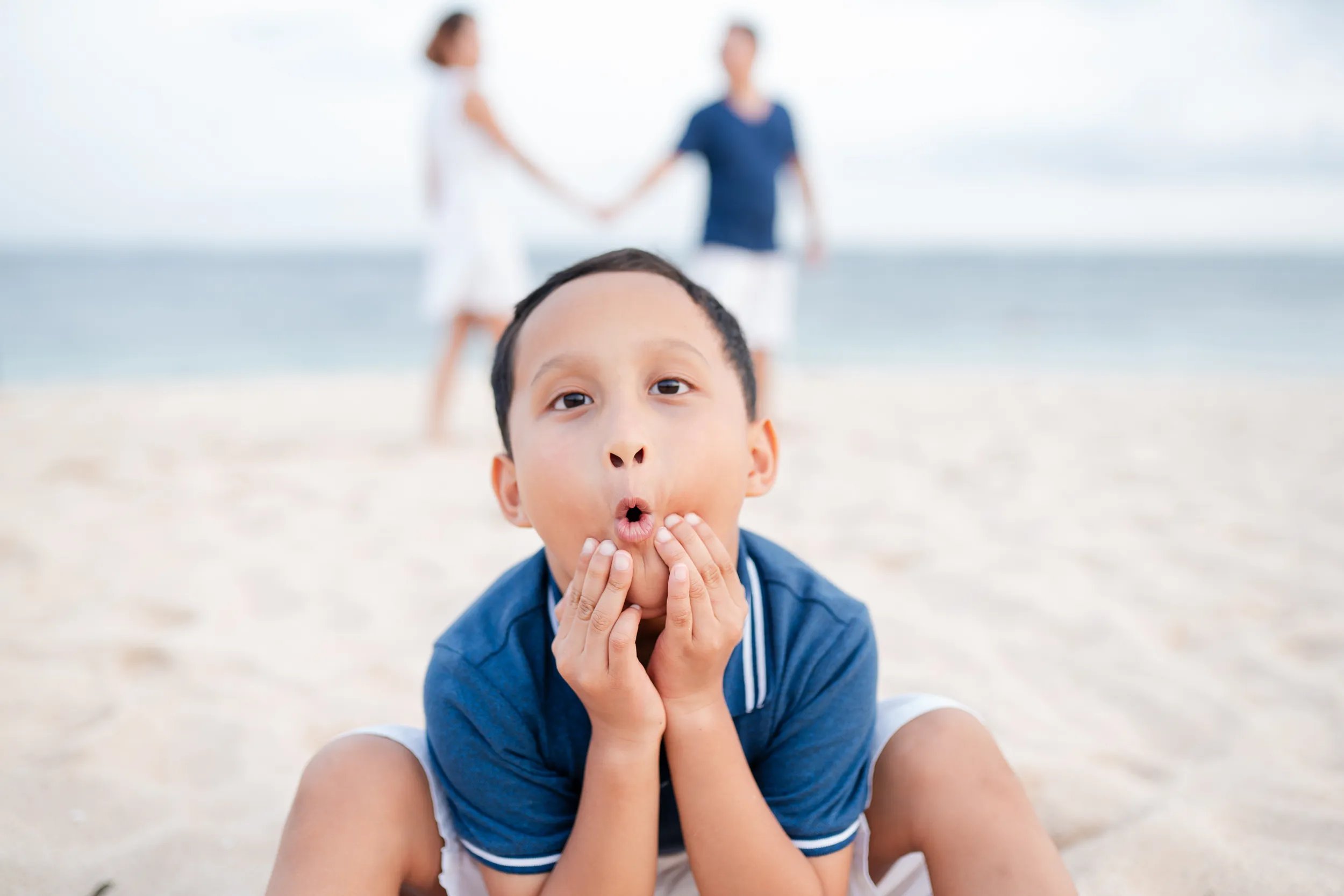 Child portrait during family photography session on beach at The Mulia Nusa Dua Bali