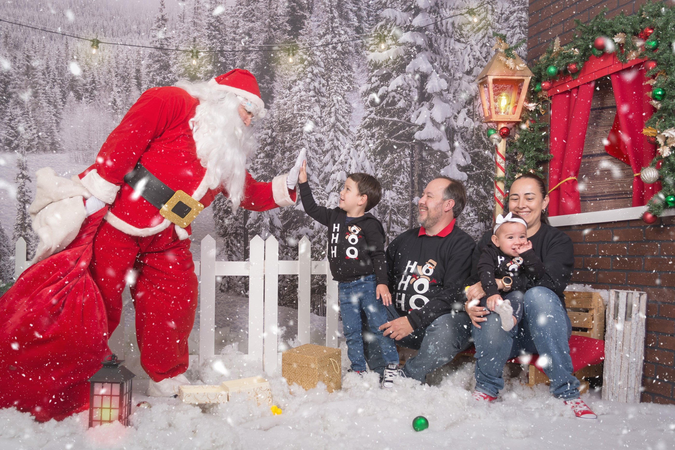 a family posing for a photo with santa claus claus claus claus claus claus claus claus