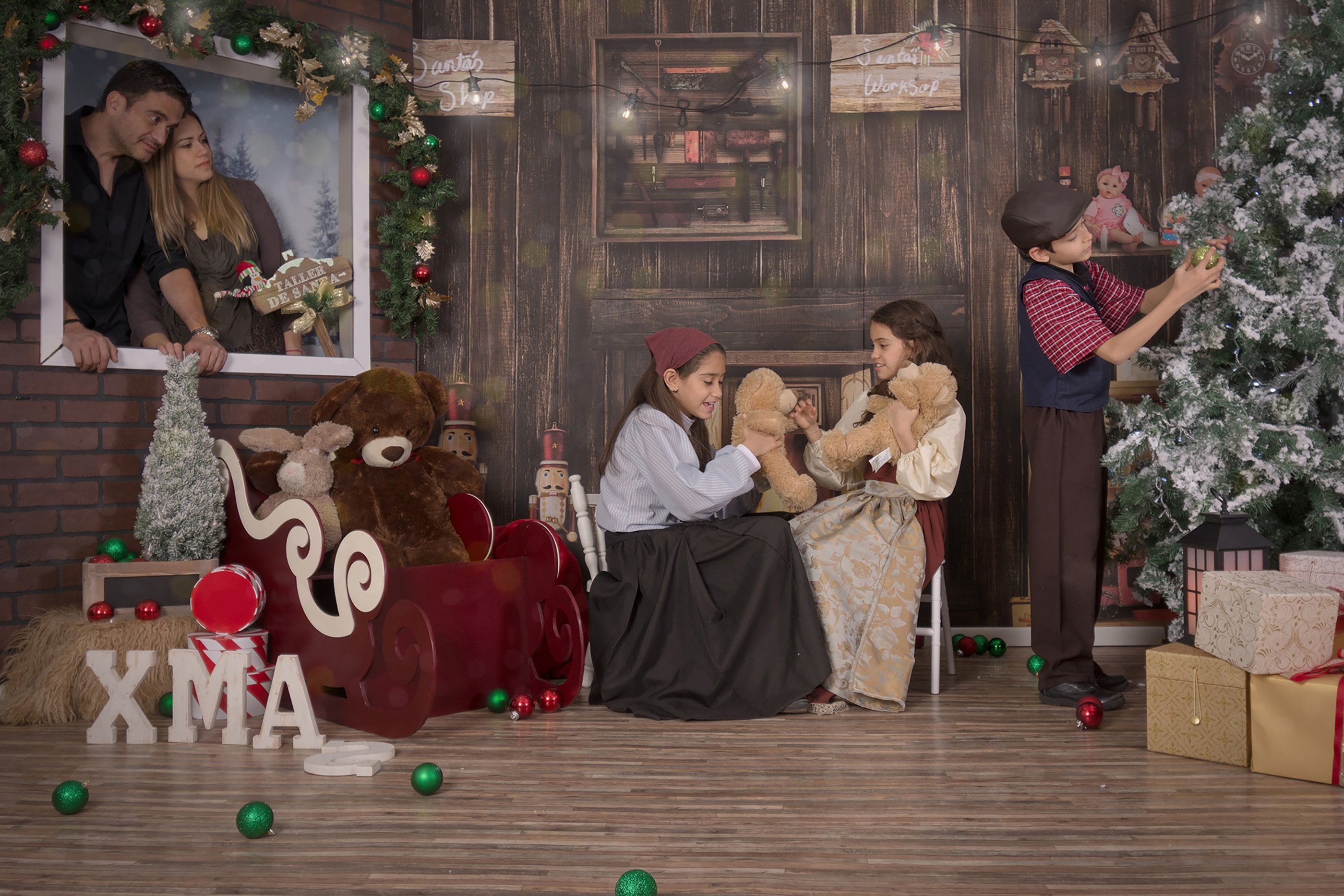 a family posing for a photo in front of a christmas tree