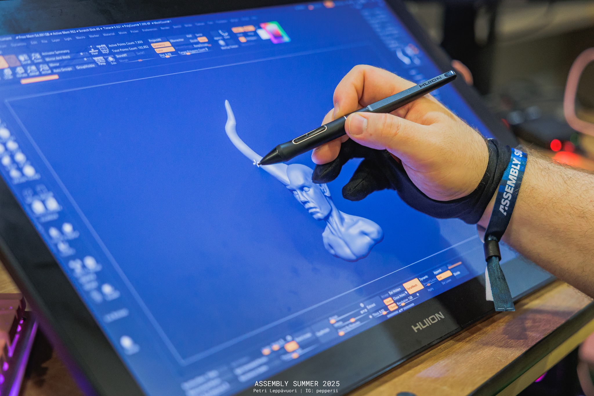 Image displaying Henri sculpting a horned bust of a demon.