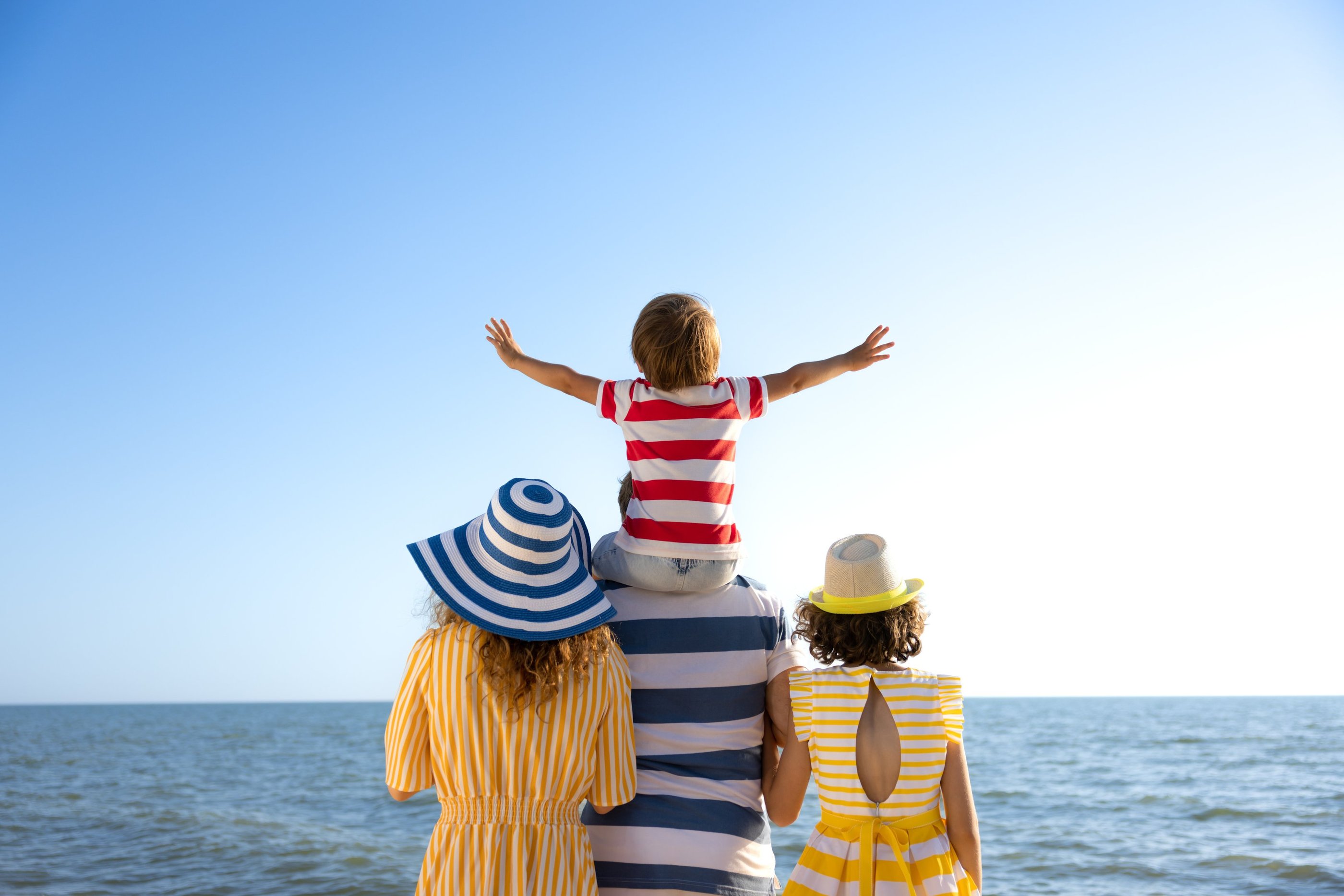 Family vacation facing beach