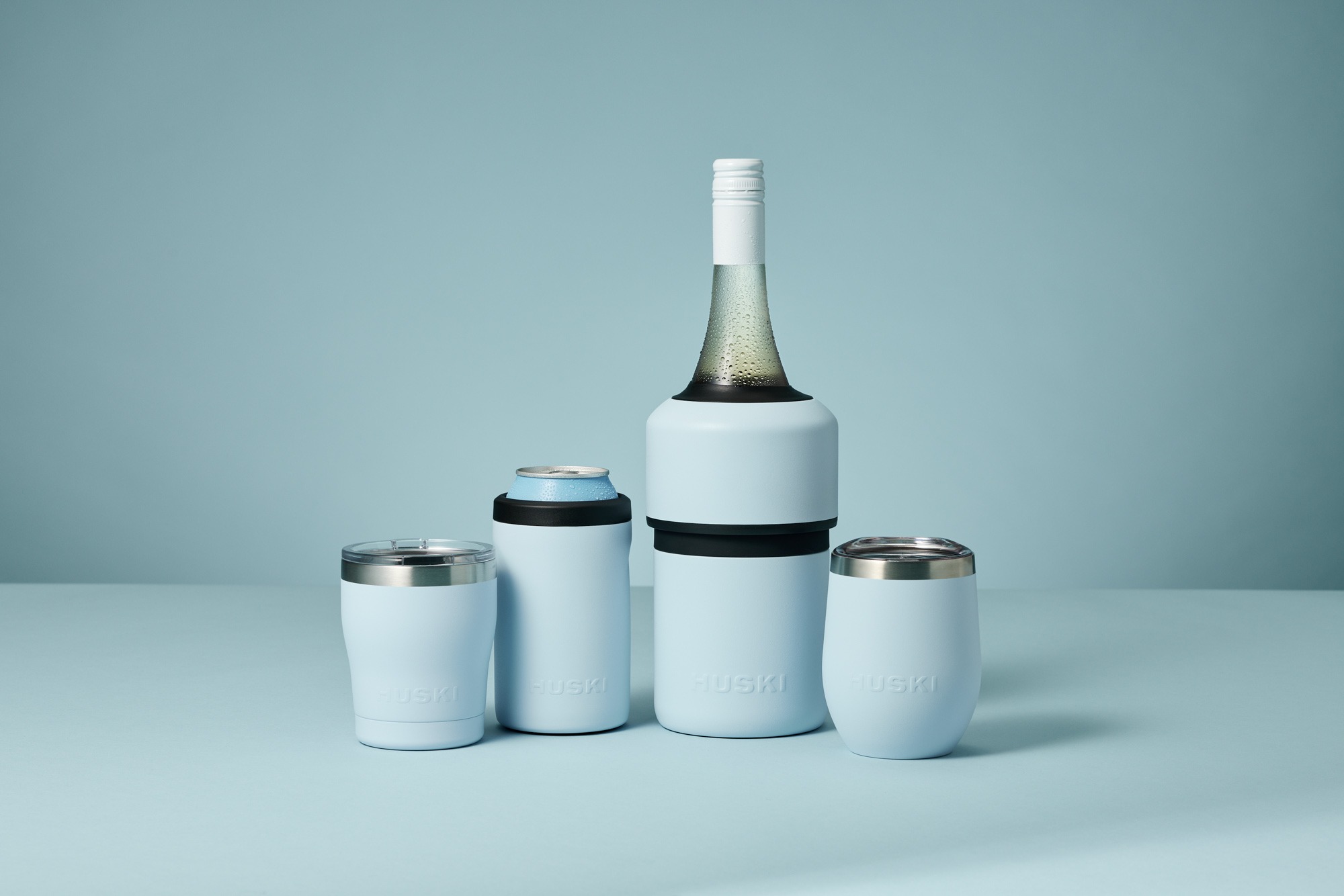 Product photography - A bottle of wine and a can inside two Huski coolers