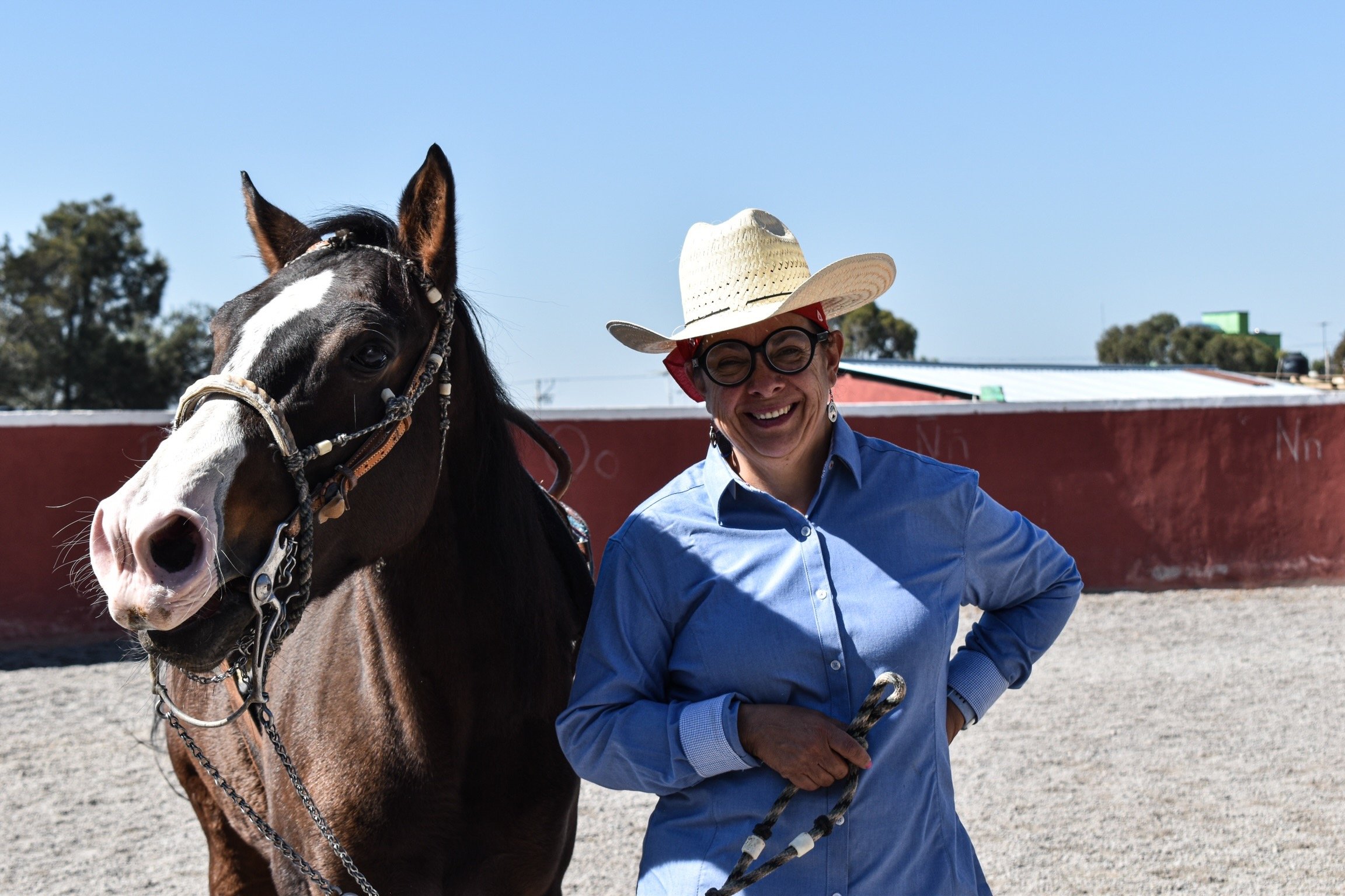 a woman in a cowboy hat and a cowboy hat