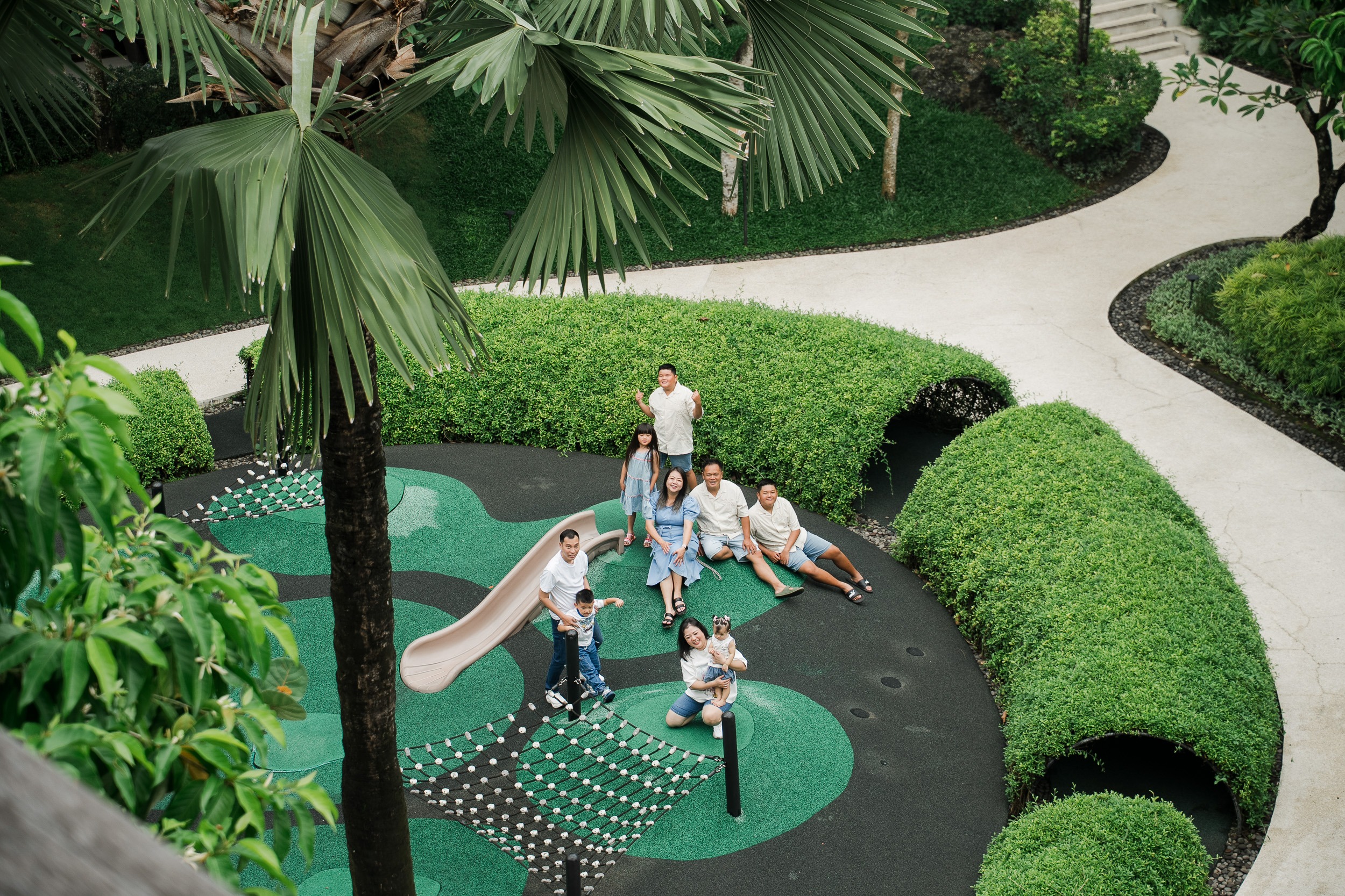 family enjoying relaxed moments together in a lifestyle photography session at Movenpick Jimbaran Bali