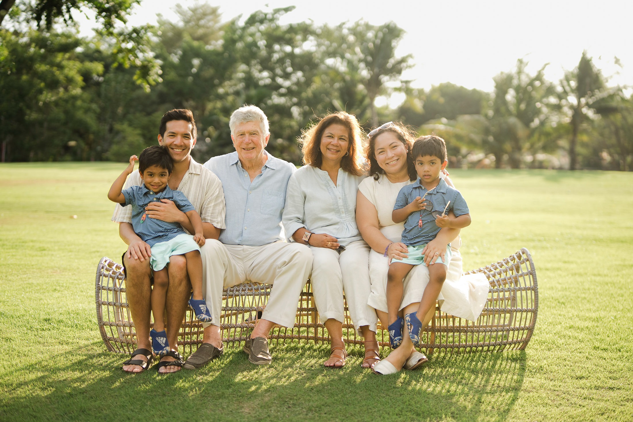 three generation family portrait on the lawn at rimba by ayana bali during a bali family photography session