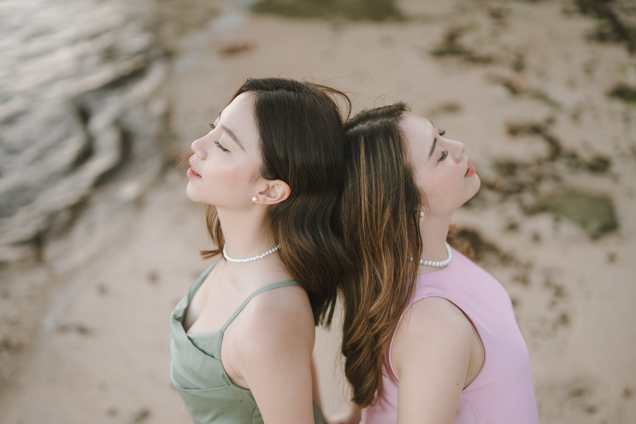 Close portrait of two friends during photoshoot at Geger Beach Nusa Dua Bali