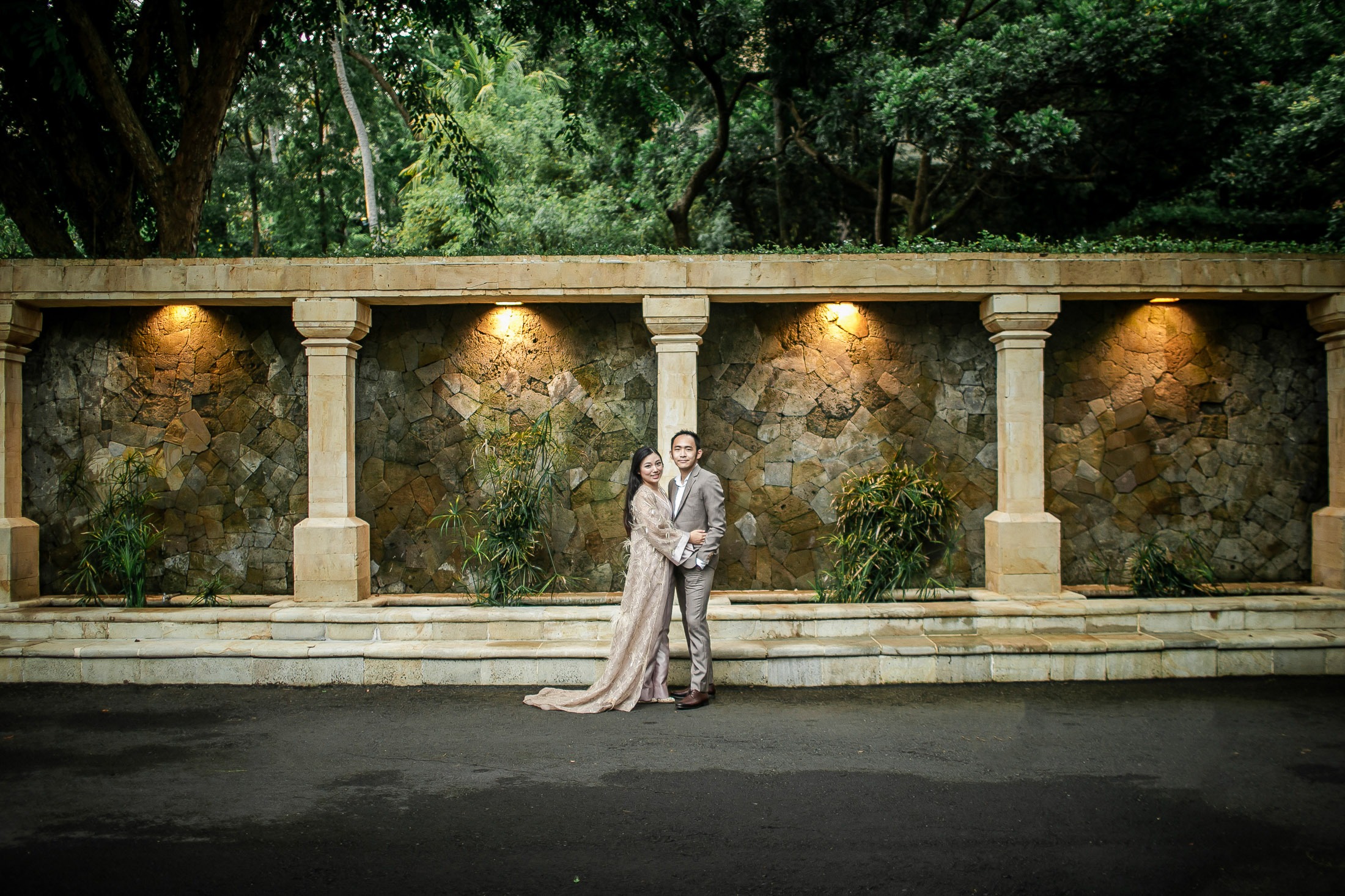 Prewedding portrait under stone arch courtyard at Amankila Karangasem Bali
