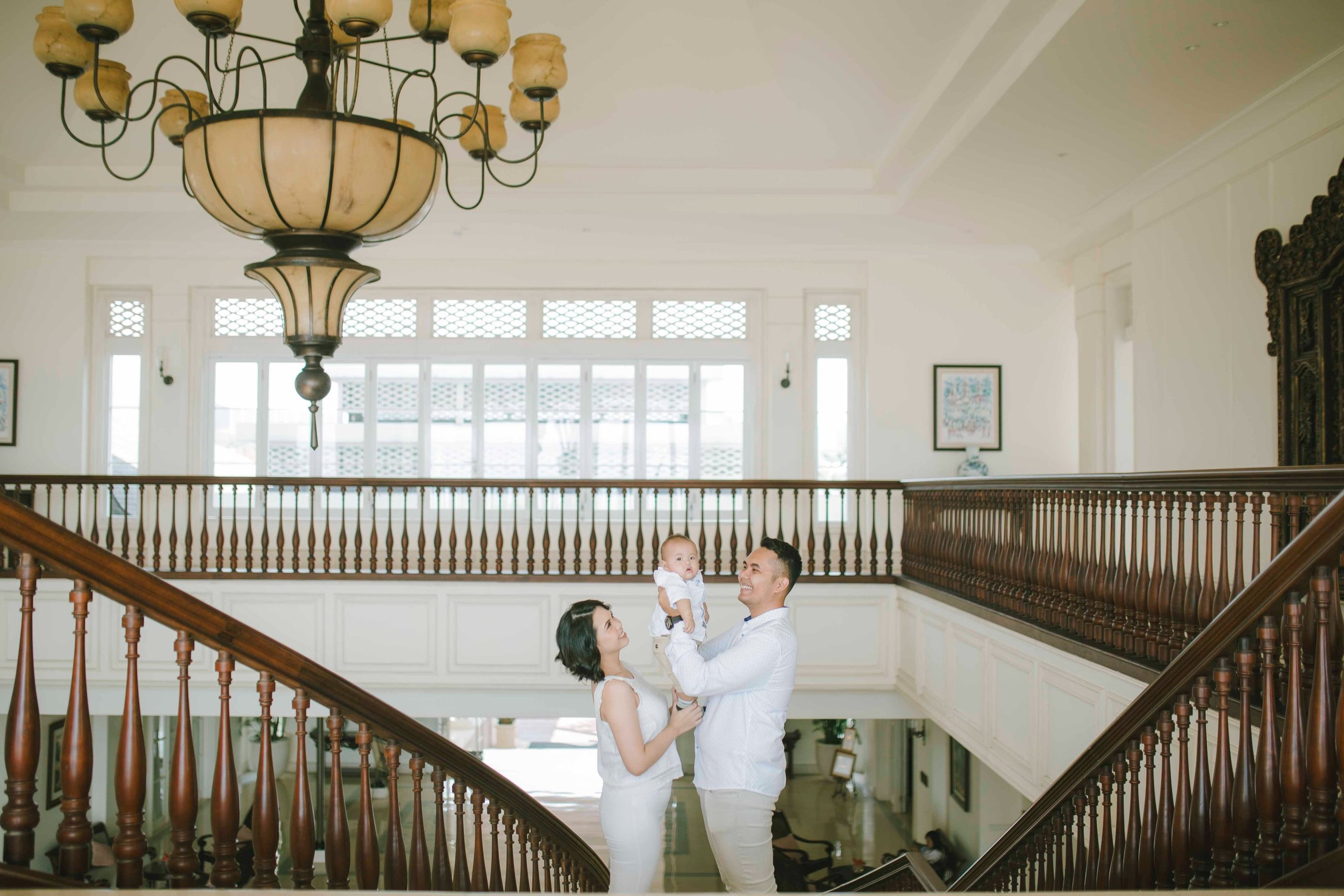 family portrait at Rumah Luwih Bali grand staircase