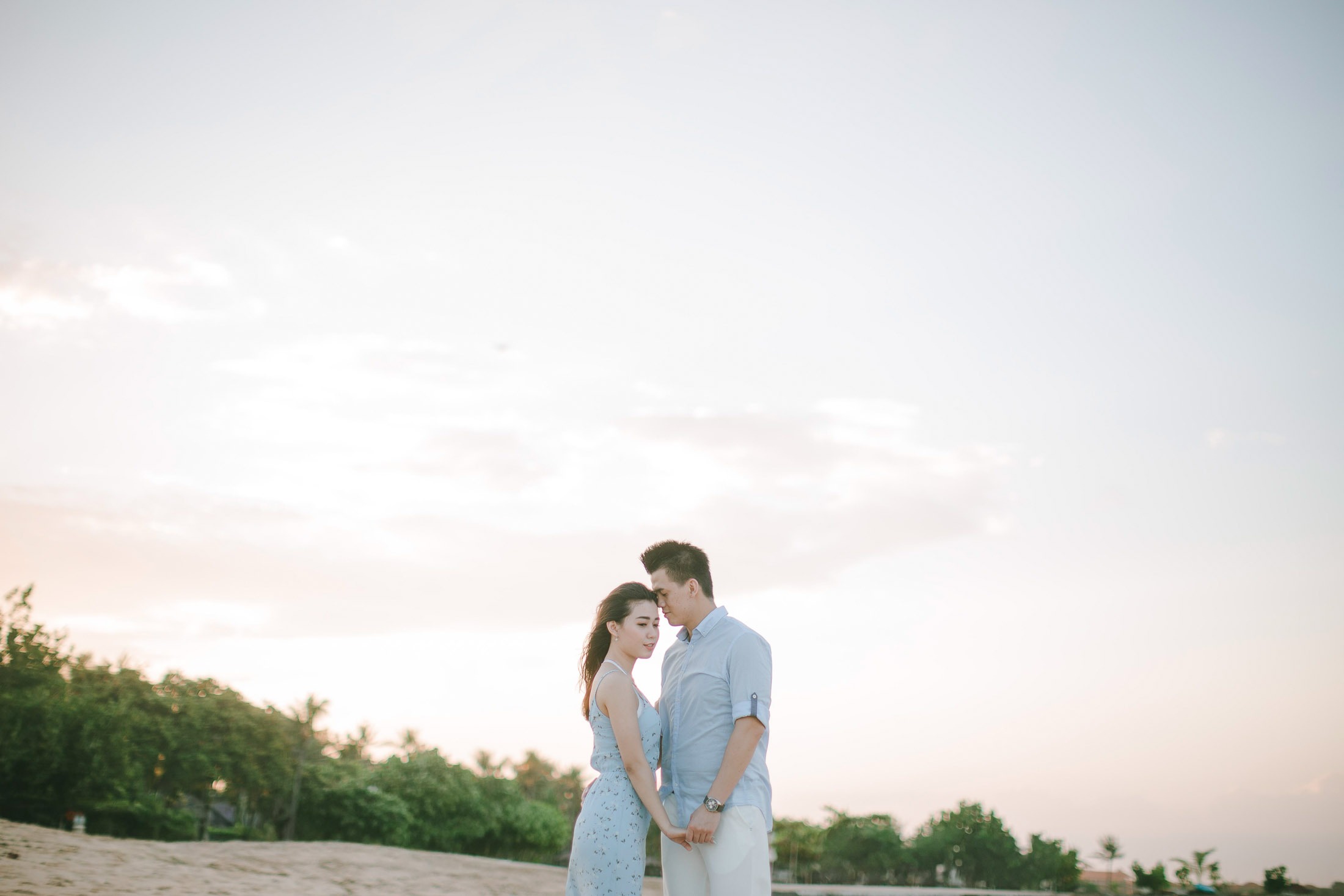 Romantic sunset couple portrait at Sofitel Bali Nusa Dua Beach Resort.