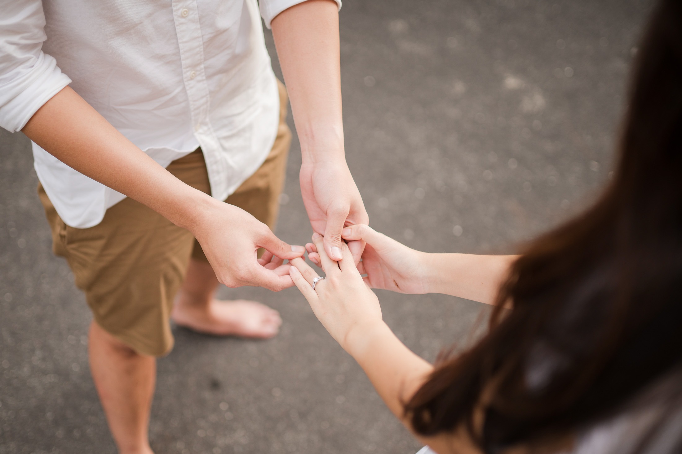 Close up of engagement ring during proposal moment at Melasti Beach Bali