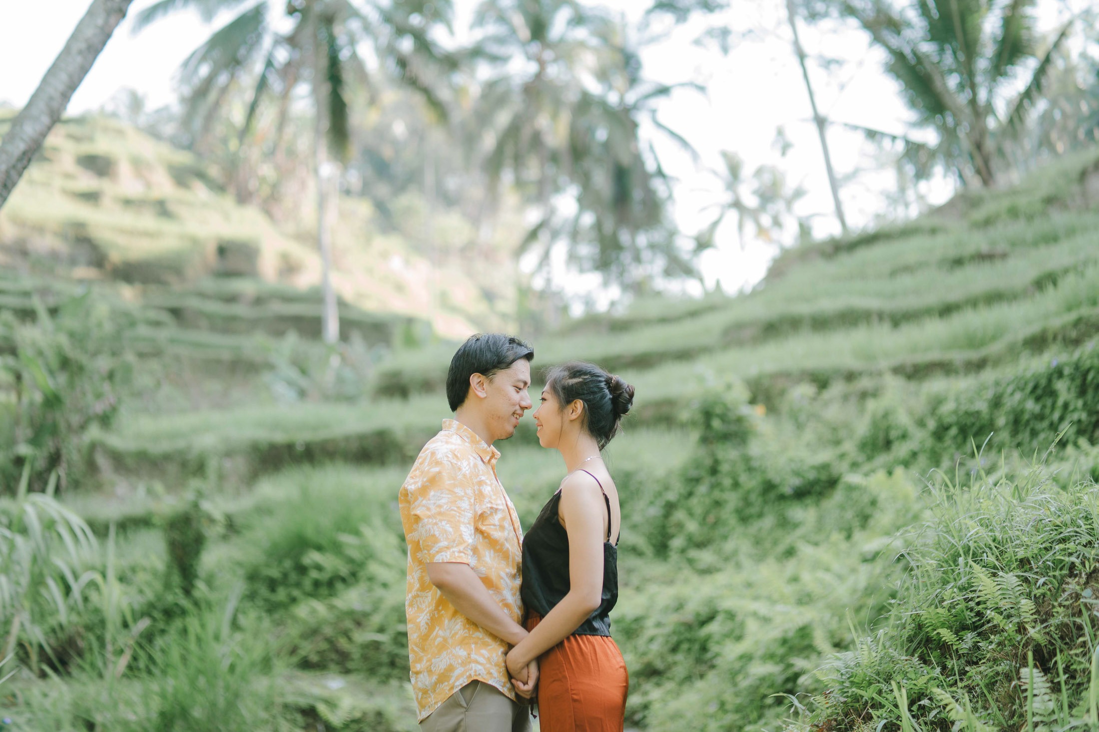 Intimate couple portrait at Tegalalang rice terrace Ubud Bali during sunrise.