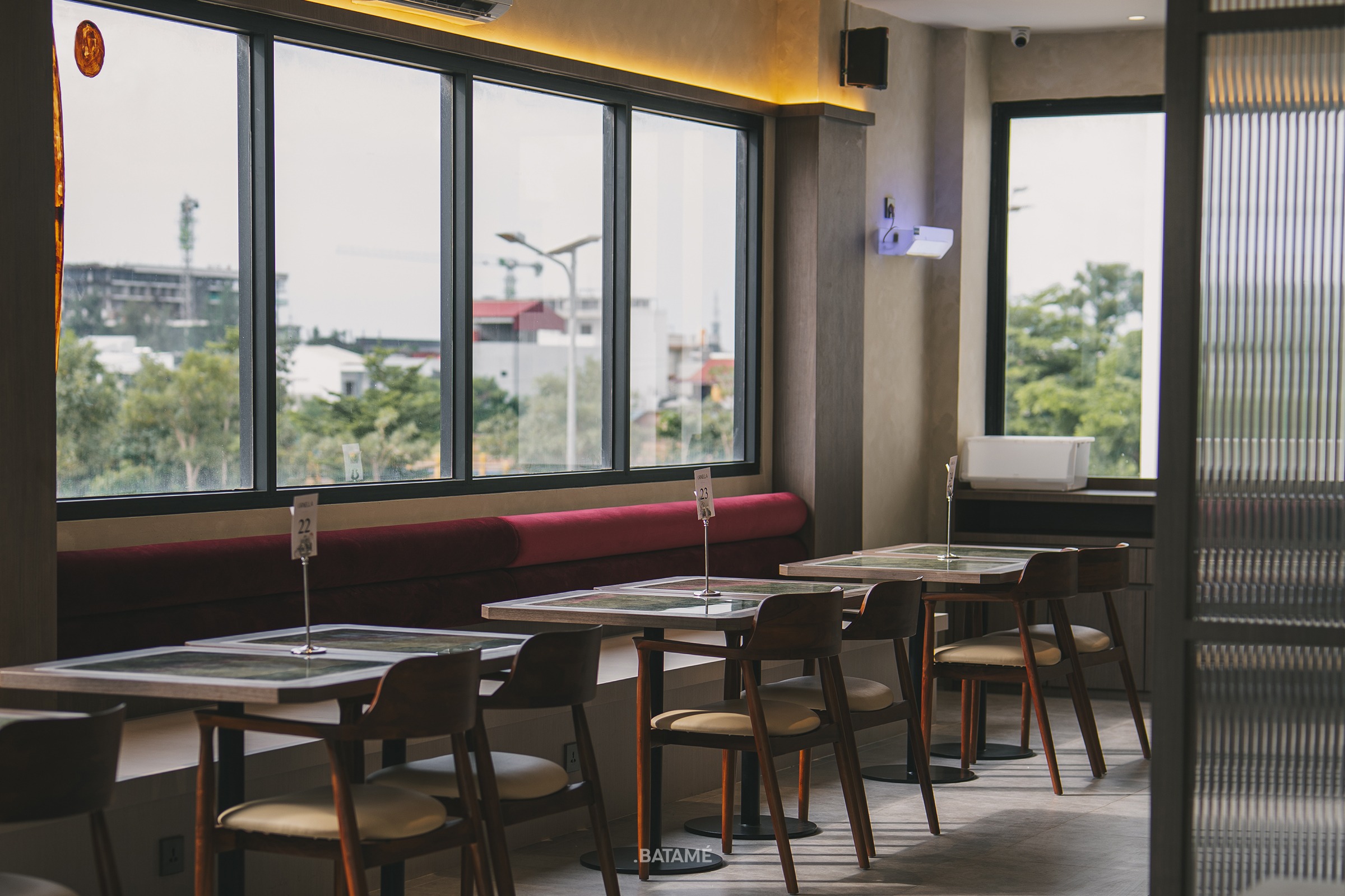 A Modern seating area with sunlight at Ornella Cafe Batam