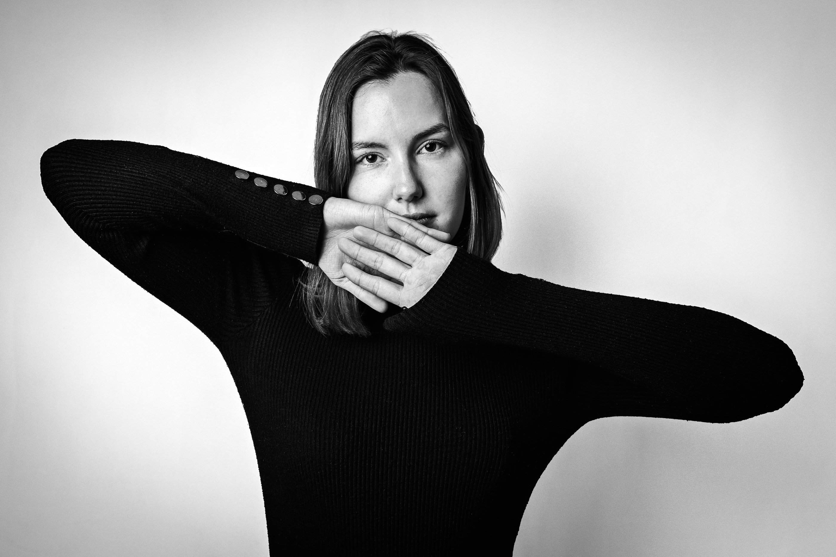 Expressive black and white portrait of a woman with a calm intense gaze