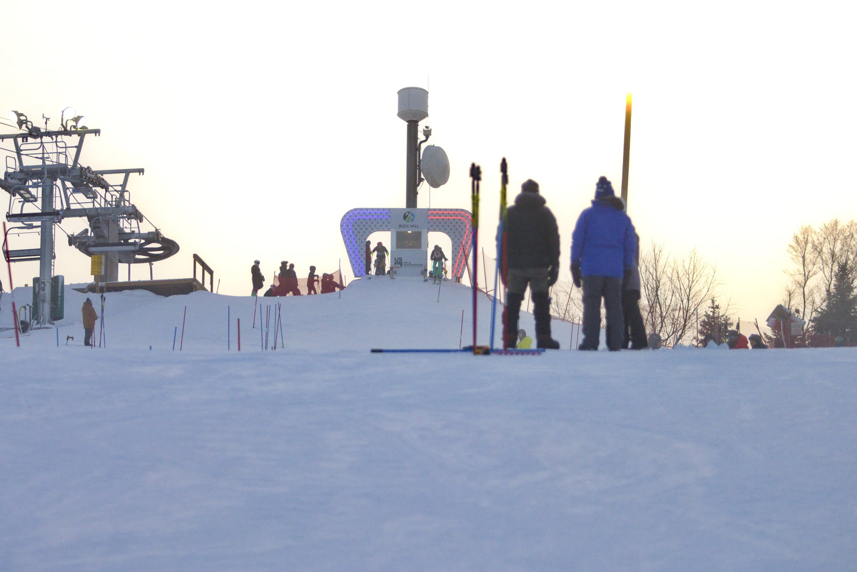 a group of people skiing down a snowy slope