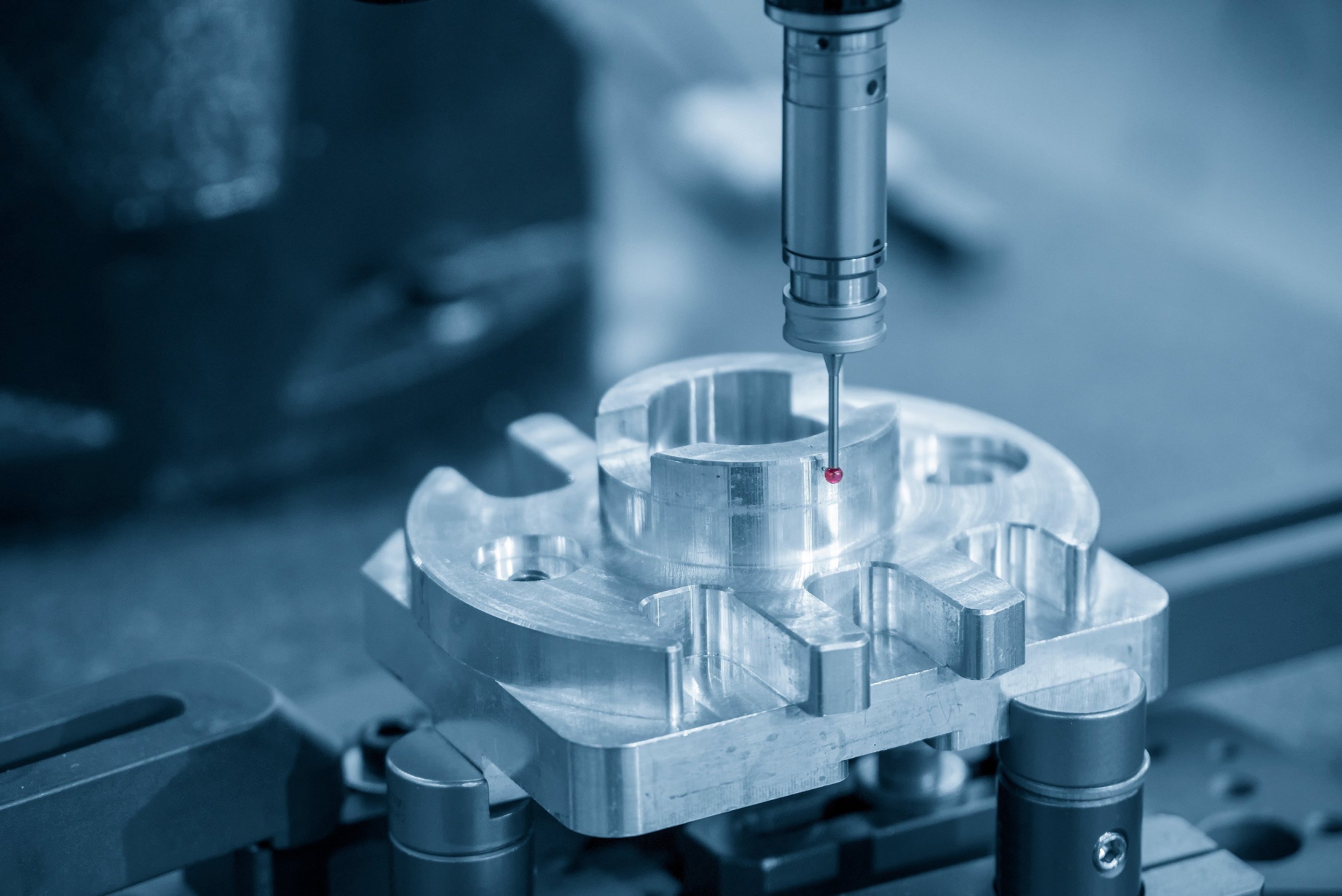 Renishaw TP200 and stylus probing a precision machined component.