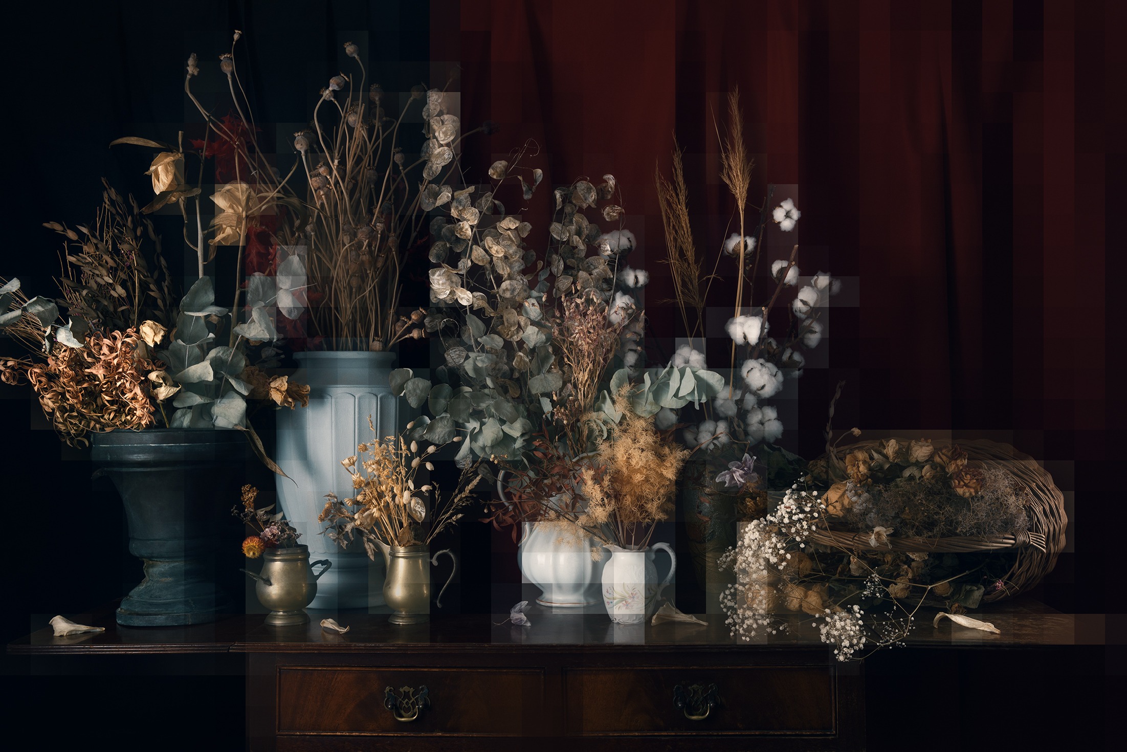 a table with vases and vases filled with flowers