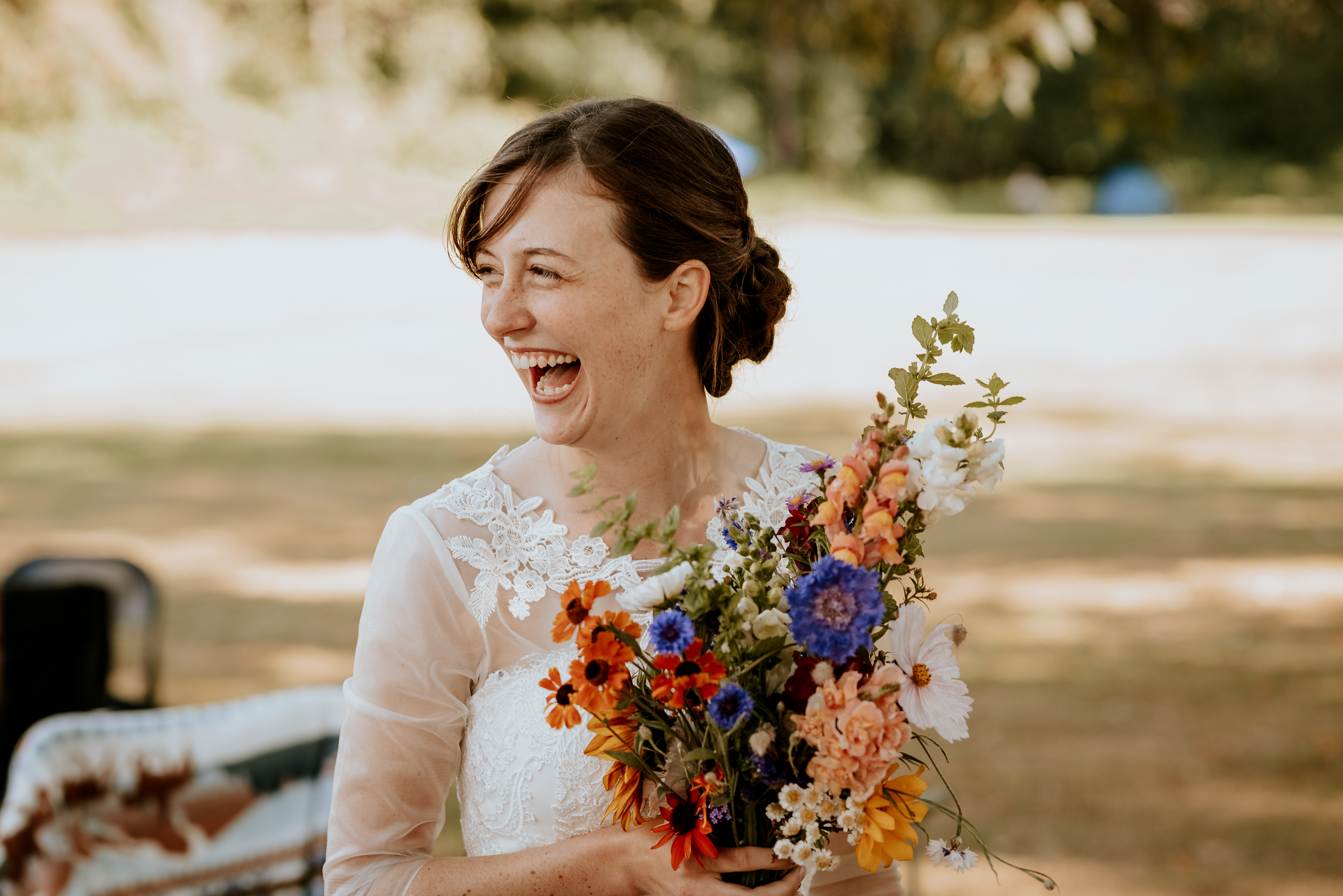 Surrey wedding photography at peace arch with bride holding flowers