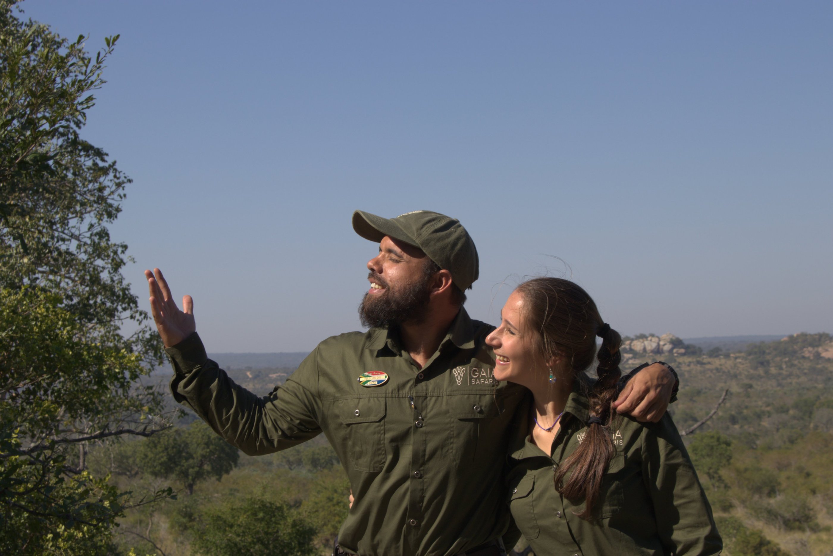 Gaia Safaris founders in African wilderness, sharing passion for conservation and community.