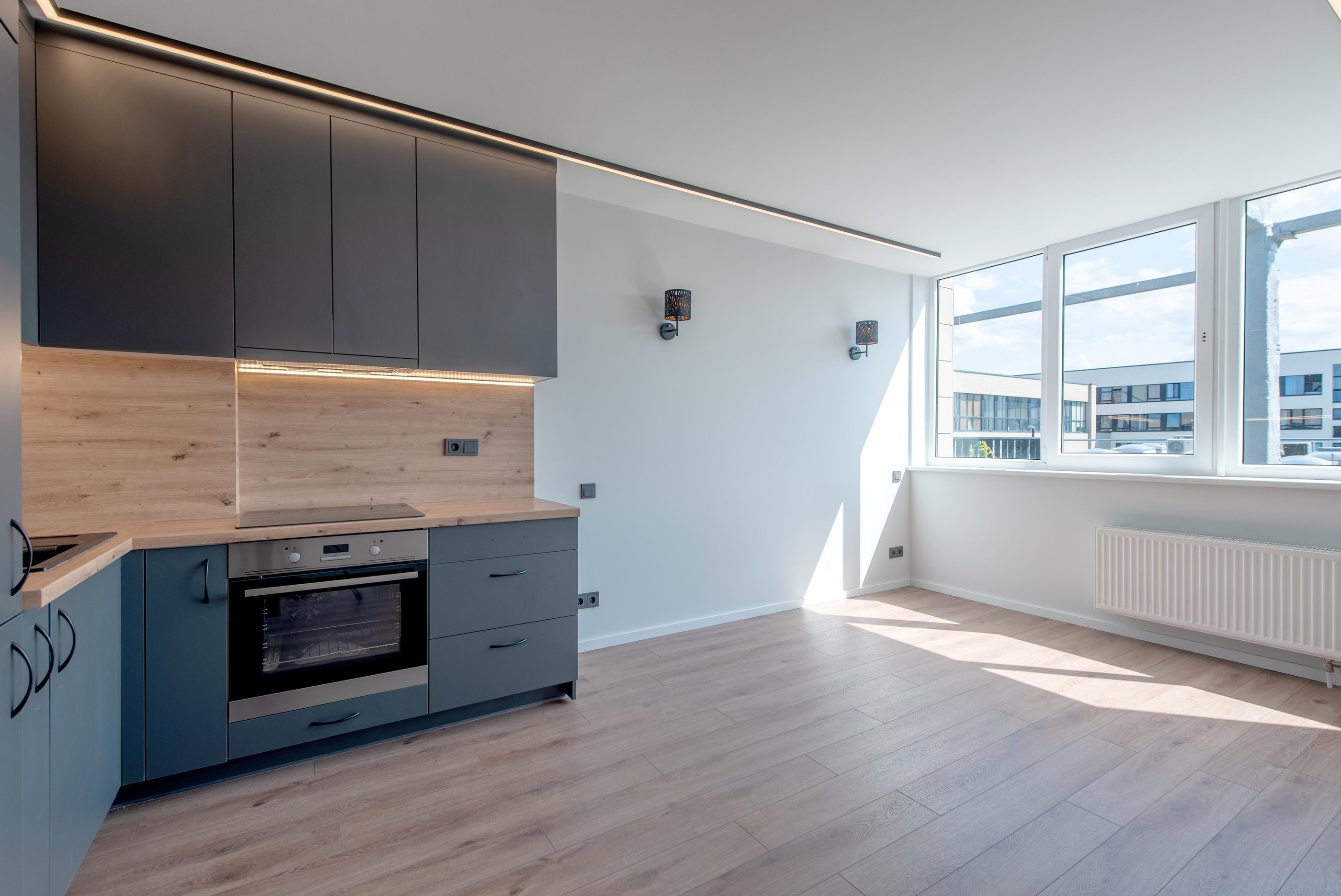 Modern kitchen with durable luxury vinyl plank flooring designed for moisture-prone spaces.