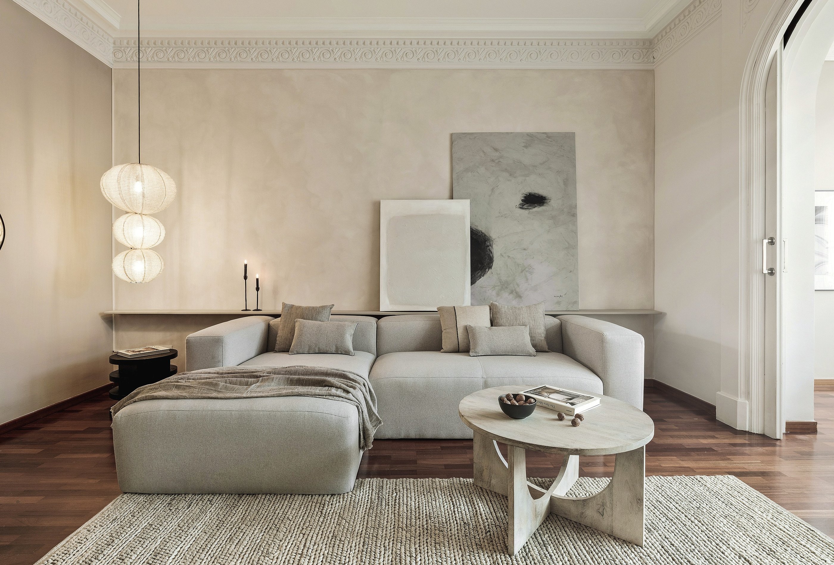Sophisticated Living room with modern decor, custom lighting, a neutral color palette and art
