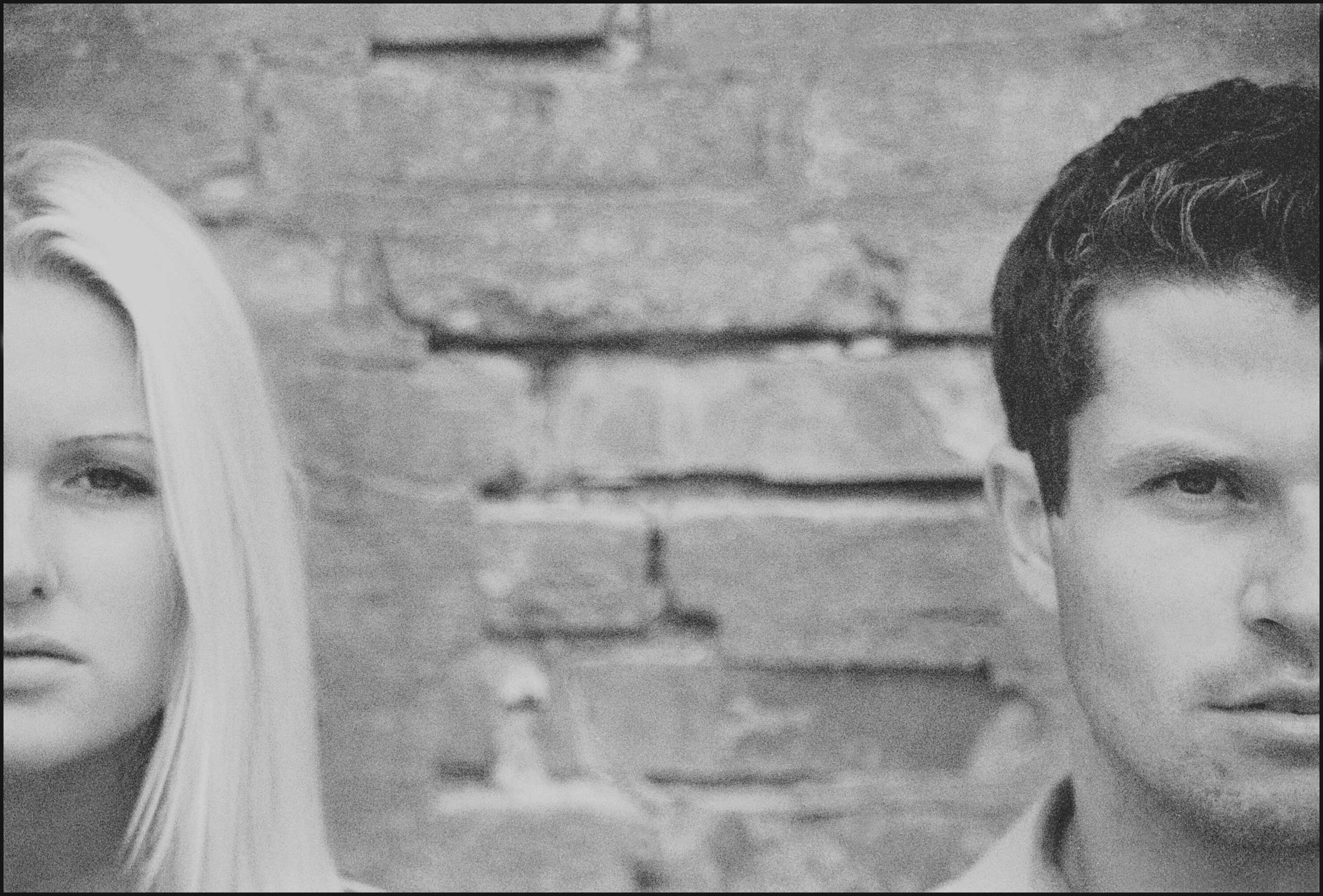 a man and woman standing next to each other