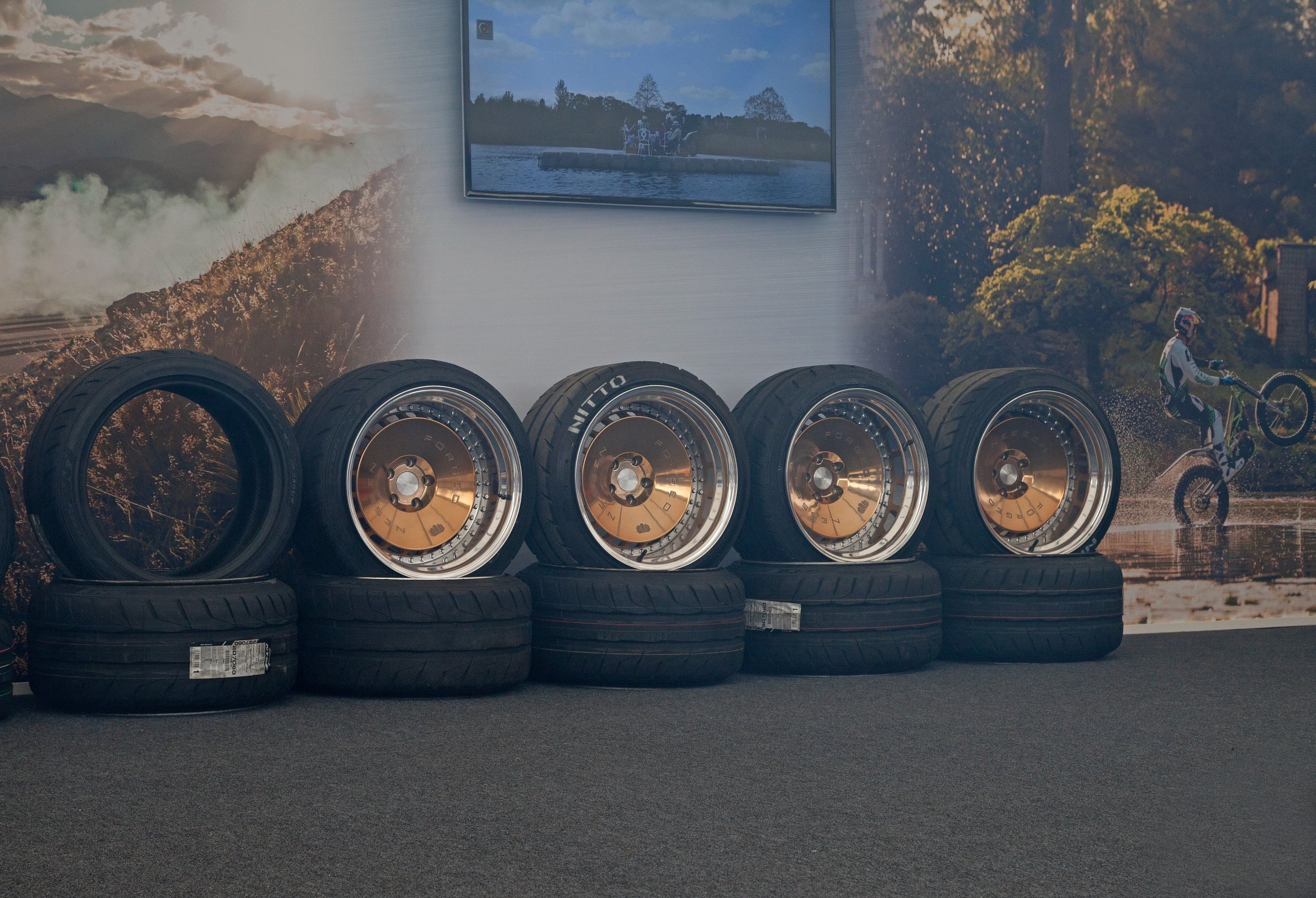 A line of wheels against a wall