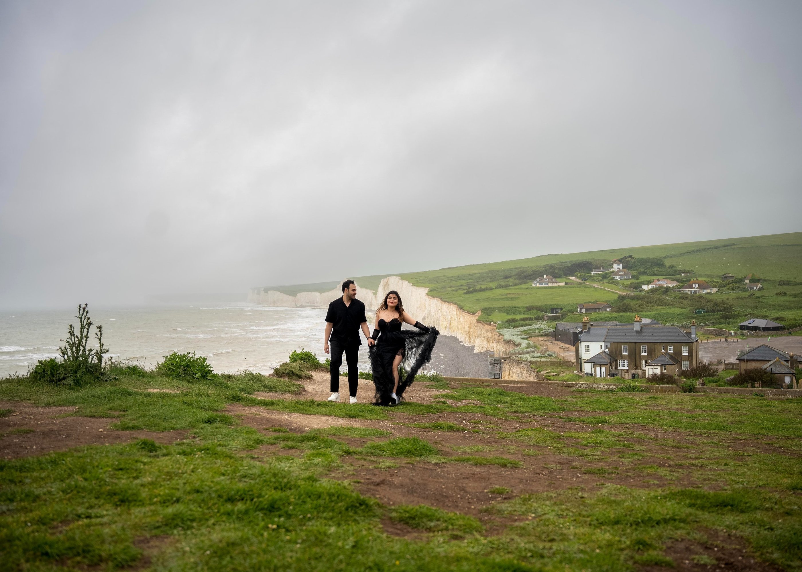 Couple walking along seaside White Cliffs – romantic outdoor photoshoot in Kent by Fred Art Studio