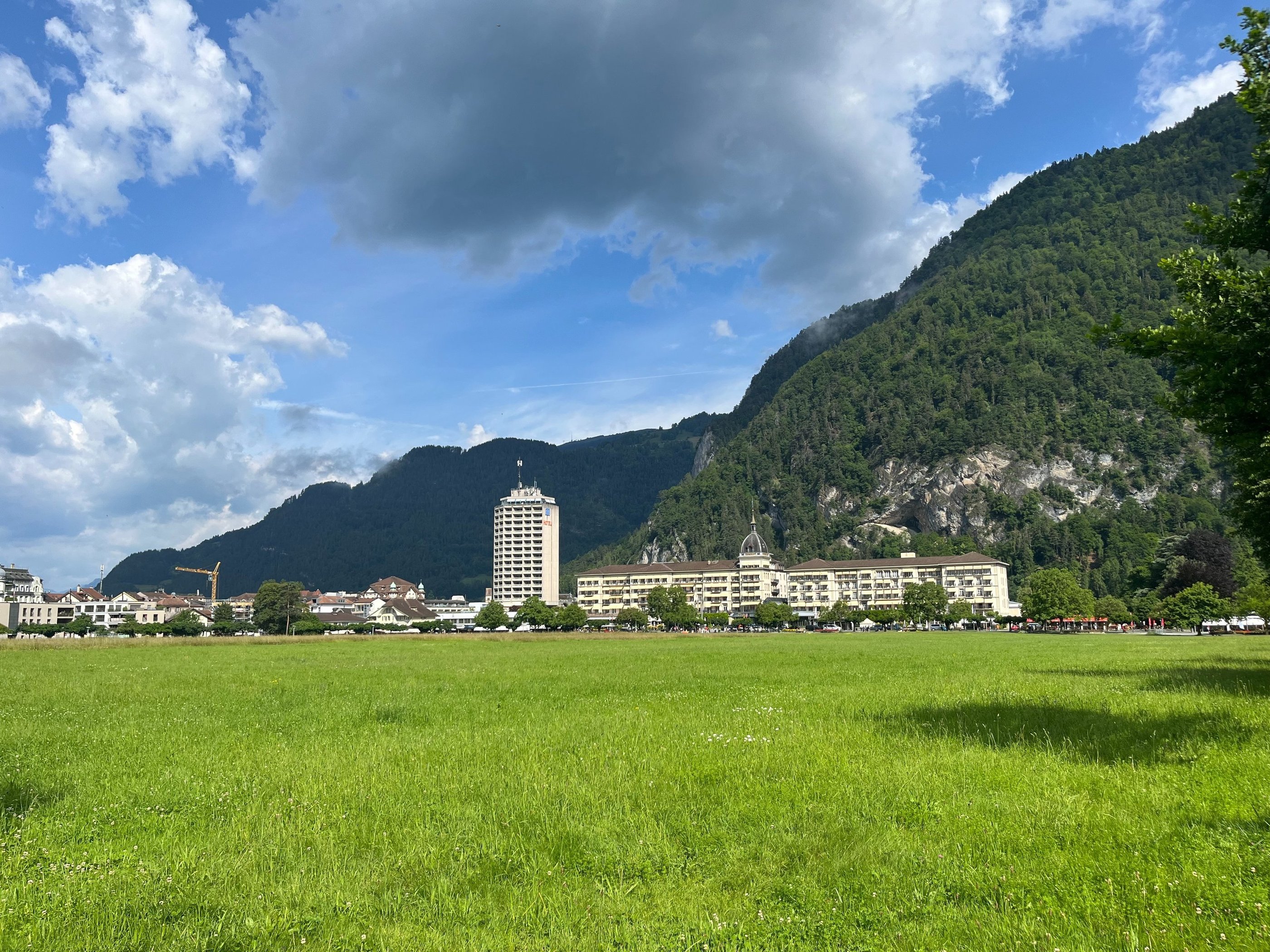 Looking across the Höhematte at Hotel Metropole and Victoria-Jungfrau in Interlaken Switzerland