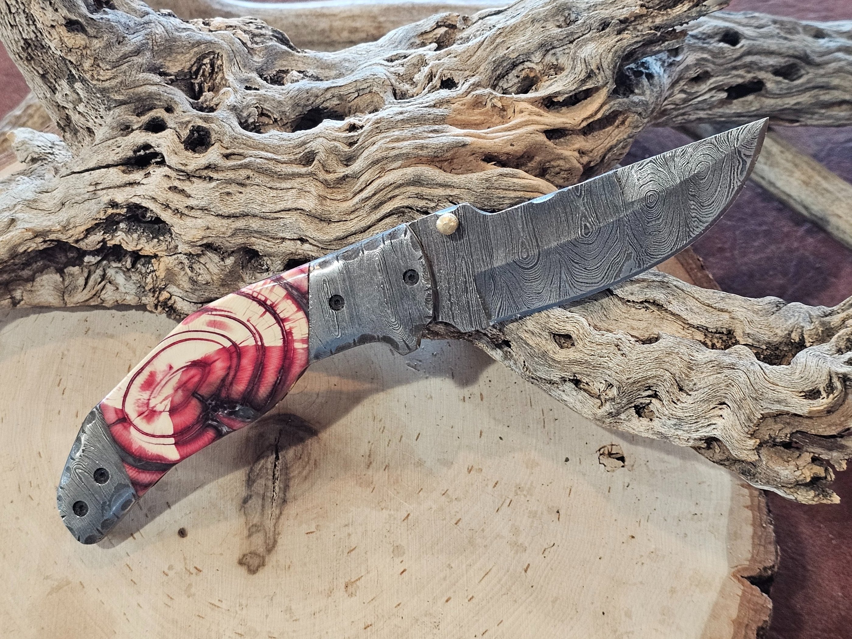 All knives are handcrafted Damascus Blades.