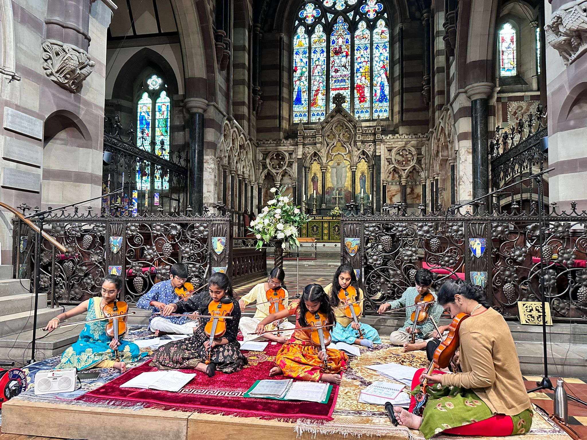 A picture of Srividya Venkat and students performing