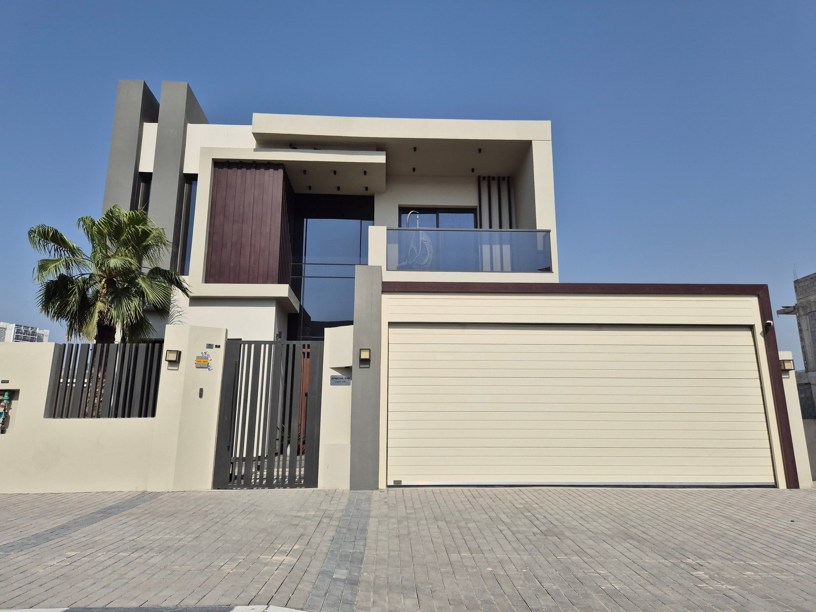 Automatic sectional overhead garage door for modern residential villa in Dubai.