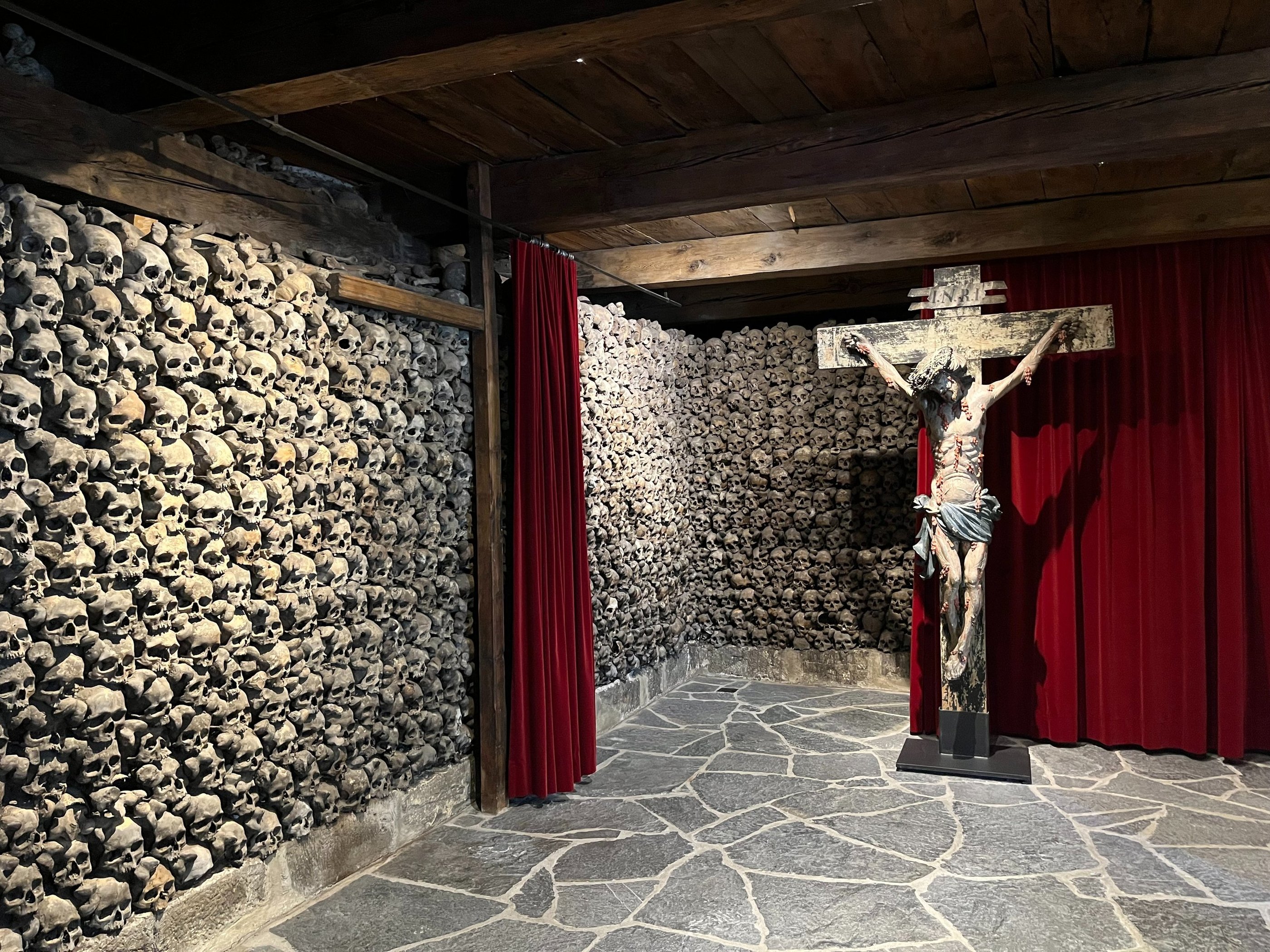 Skulls stacked floor to ceiling in the Leuk Beinhaus/Leuk Ossuary