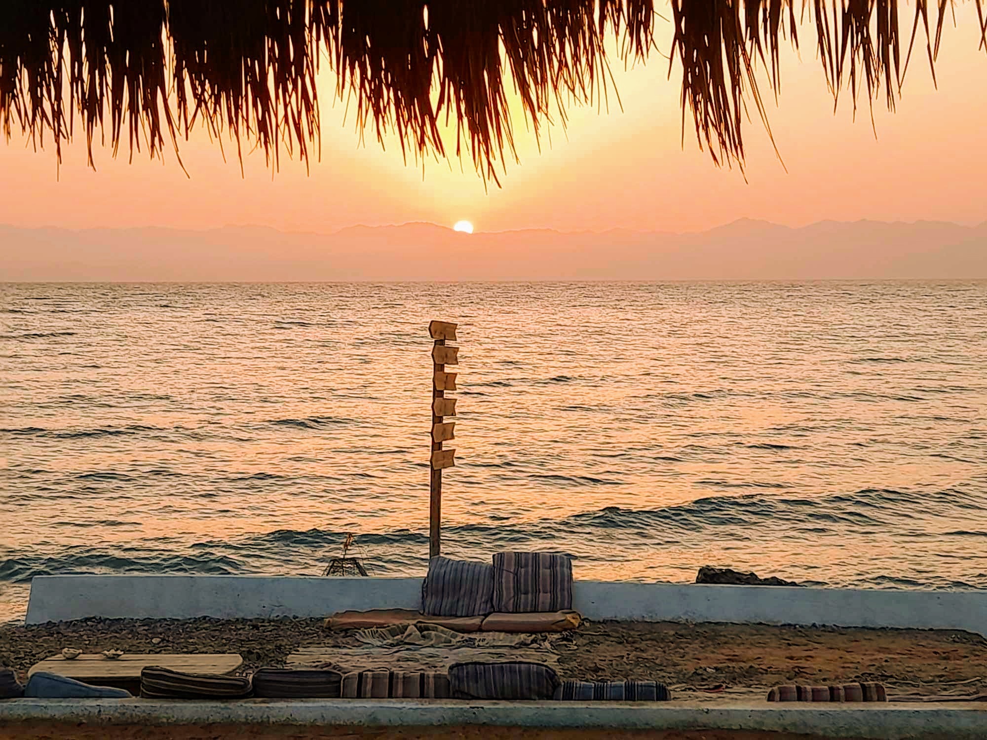 Sunrise over the Red Sea at Bedouin Star beach camp in Ras Shitan Egypt.