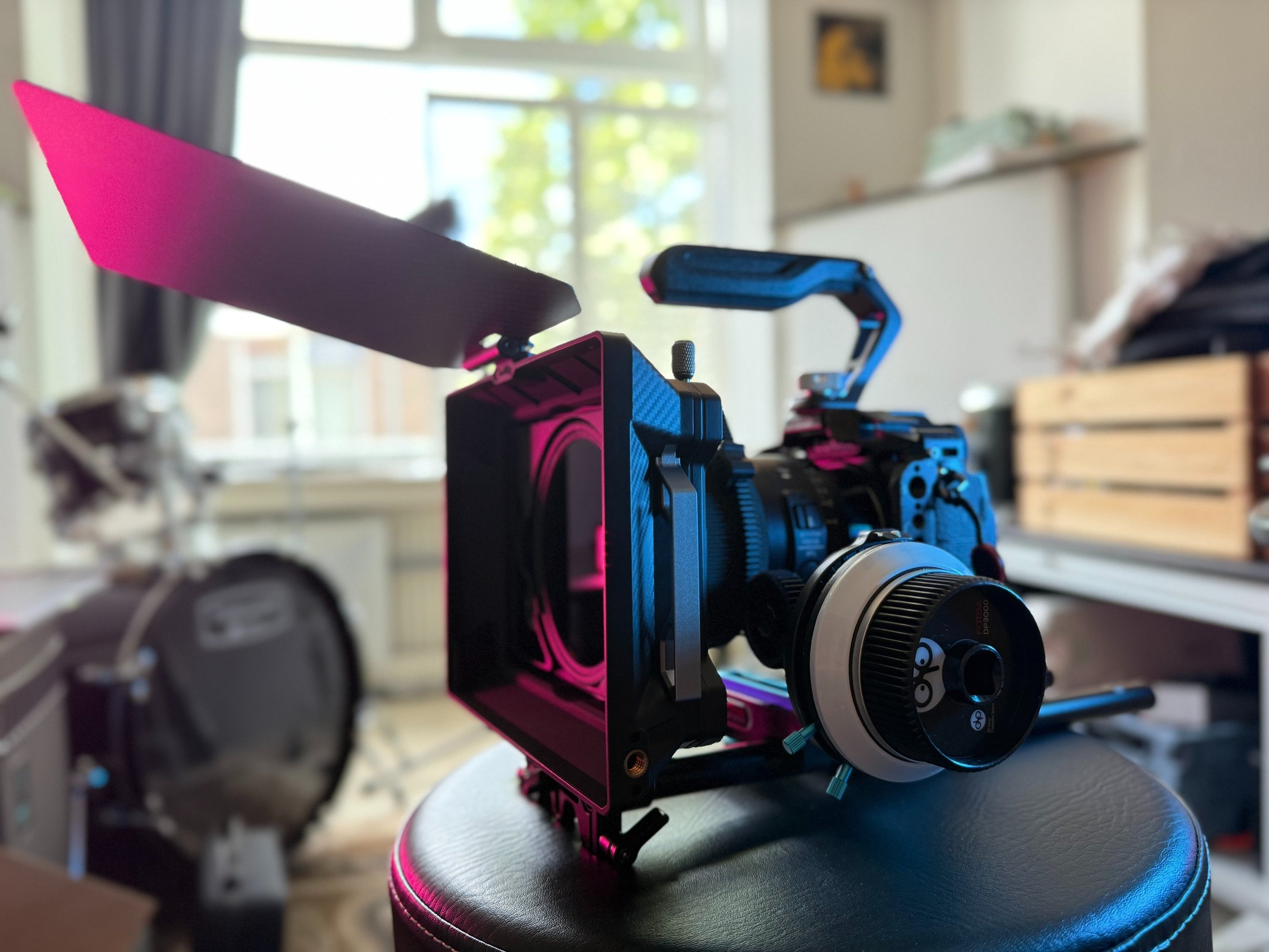 A Lumix S5 hybrid camera rigged with matte box and follow focus.