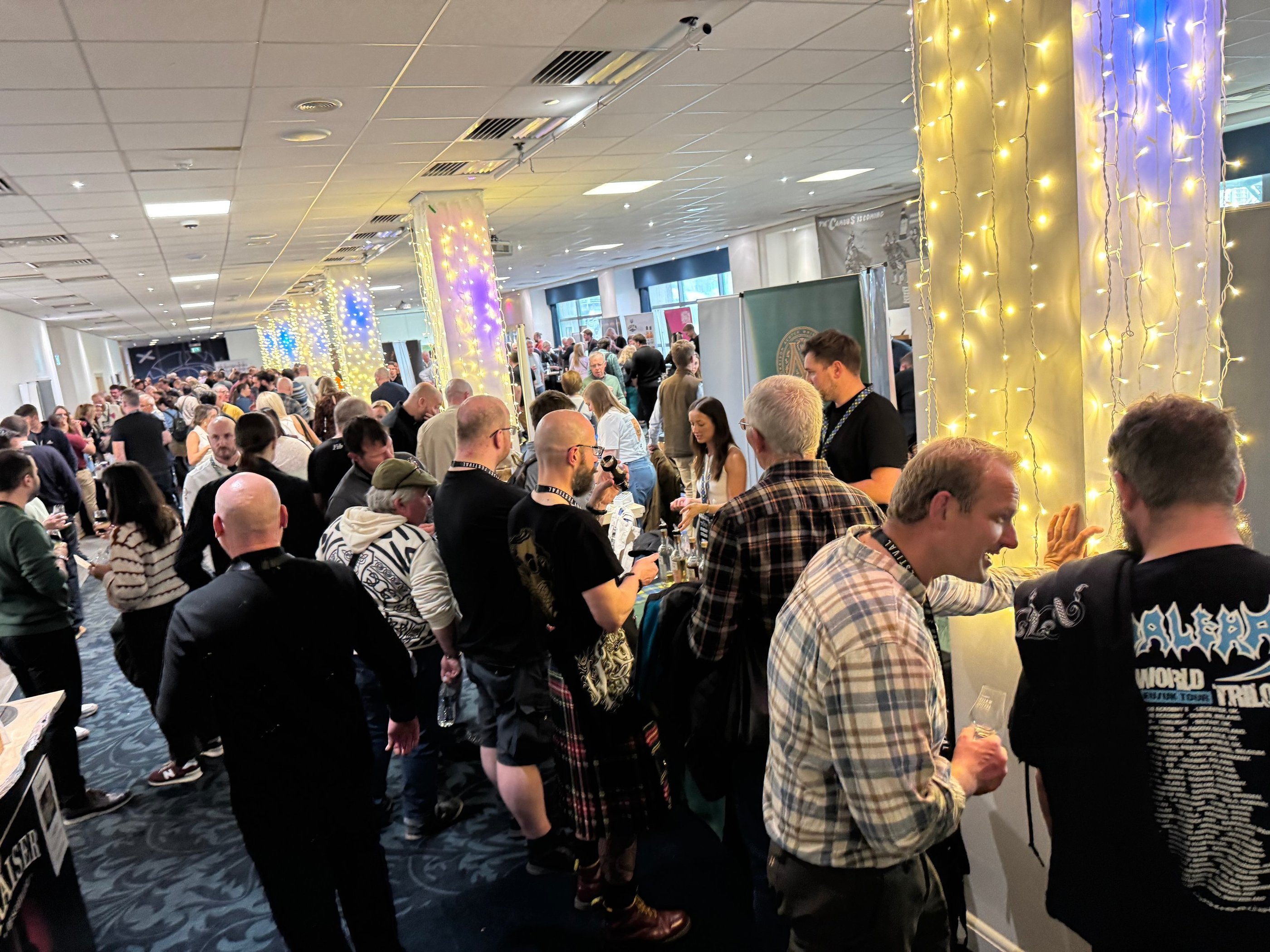 group shot of people at The Edinburgh Whisky Whisky Festival in Edinburgh, Scotland.