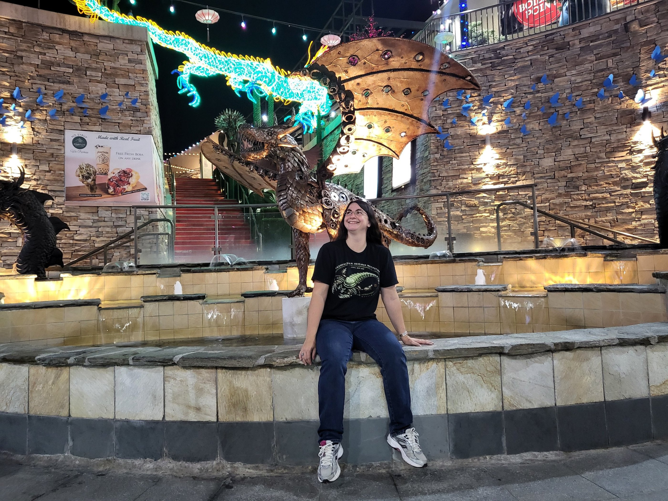 Andrielle with dragon statue