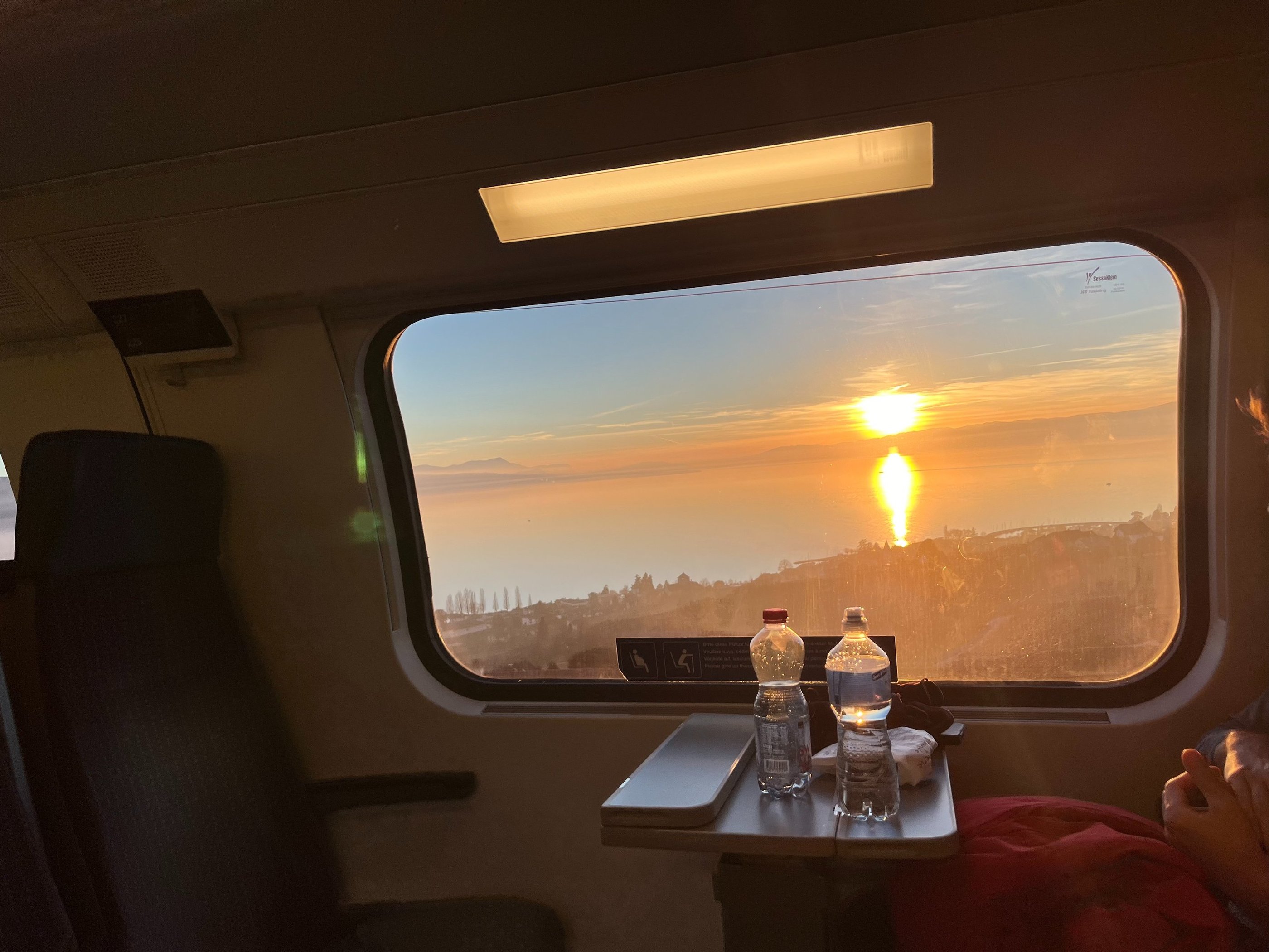 View of a sunset over Lake Geneva from the train outside of Geneva Switzerland