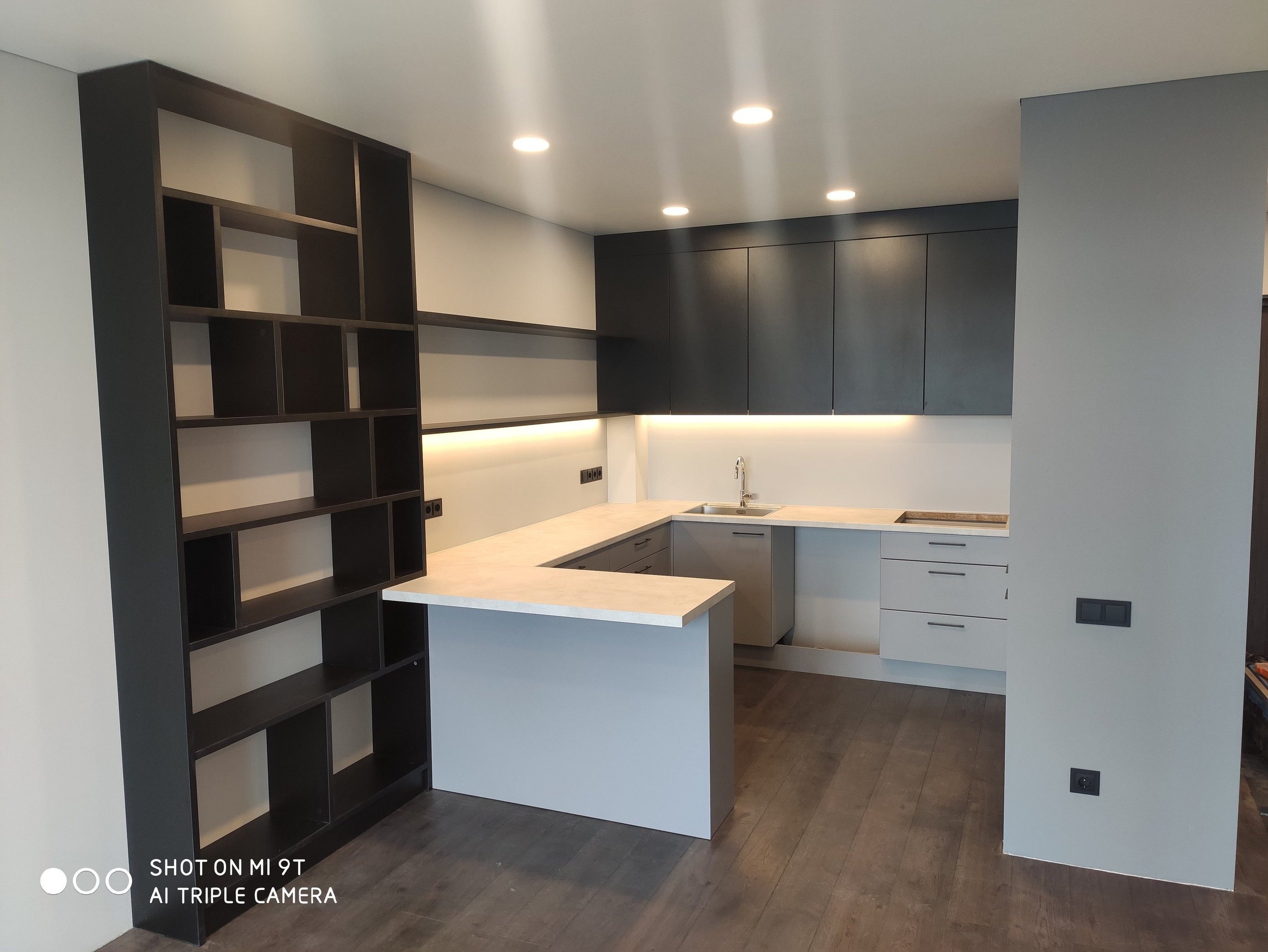 Bespoke kitchen with book shelves