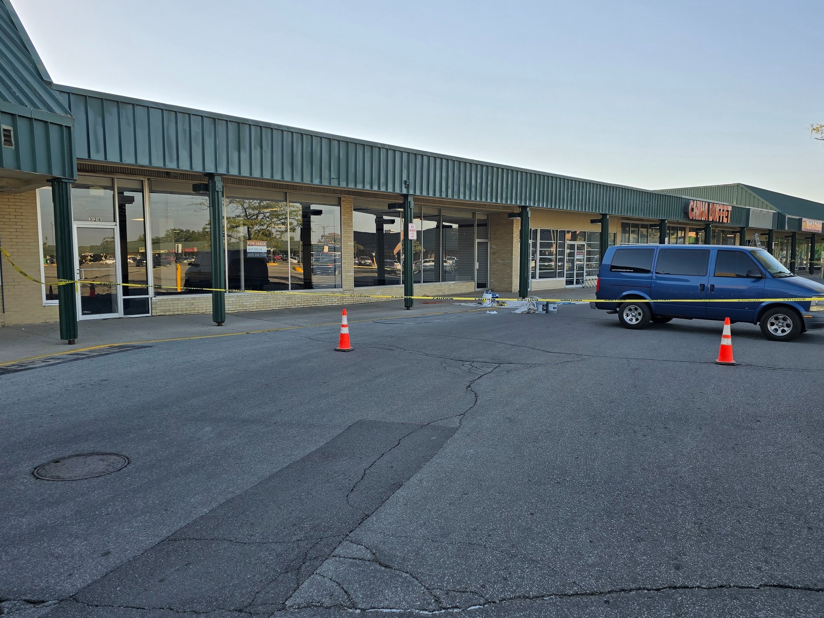 Prep, prime and repainting of storefront.
